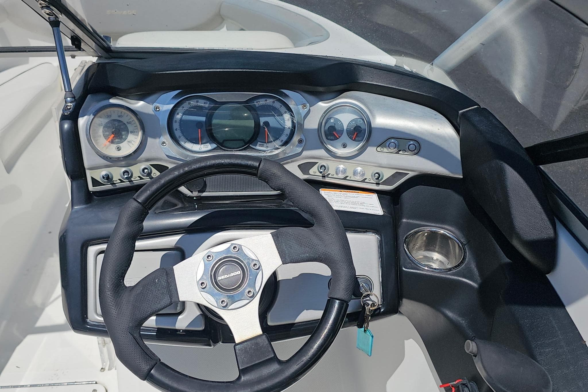 2010 Sea-Doo 210 Challenger SE dashboard with steering wheel and instrument panel.