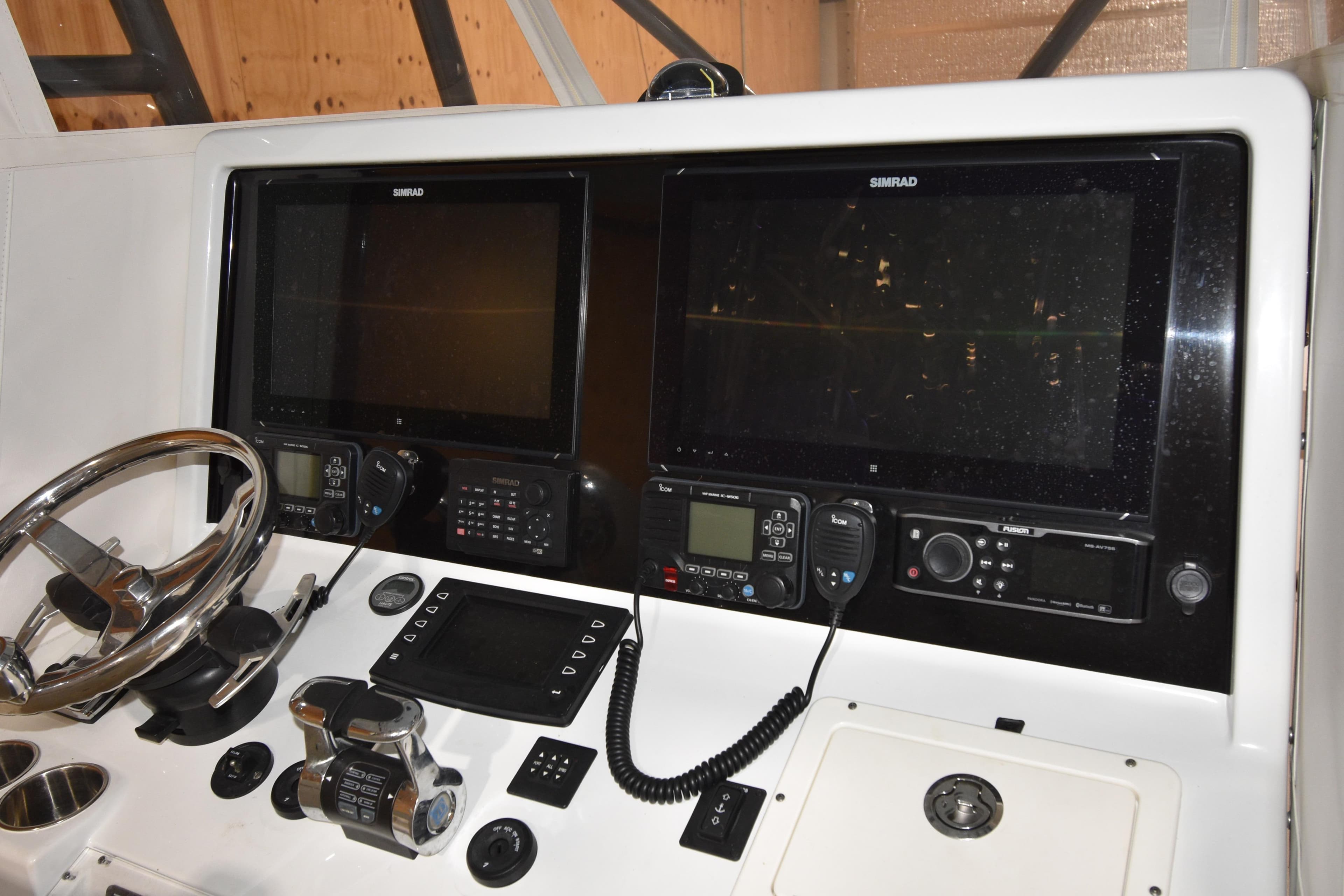Control panel of a 2016 Freeman 37VH boat with dual Simrad displays.