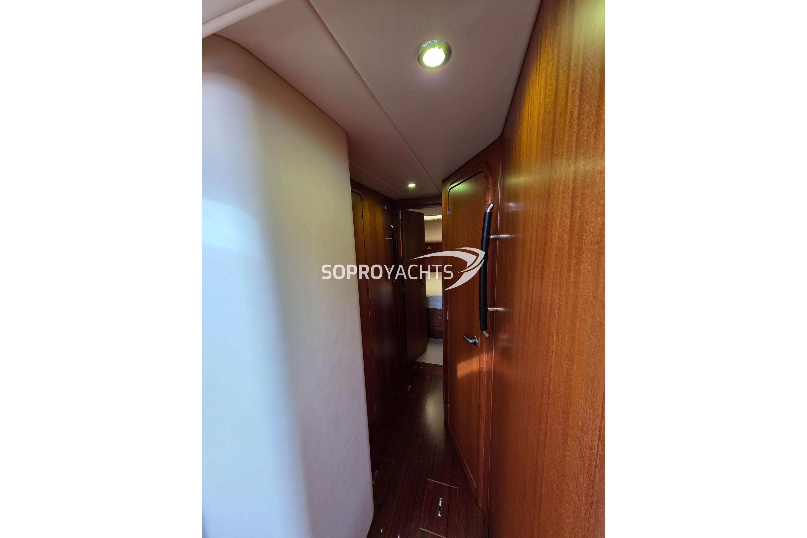 Interior hallway of 2009 Najad 570 CC yacht with wooden paneling.
