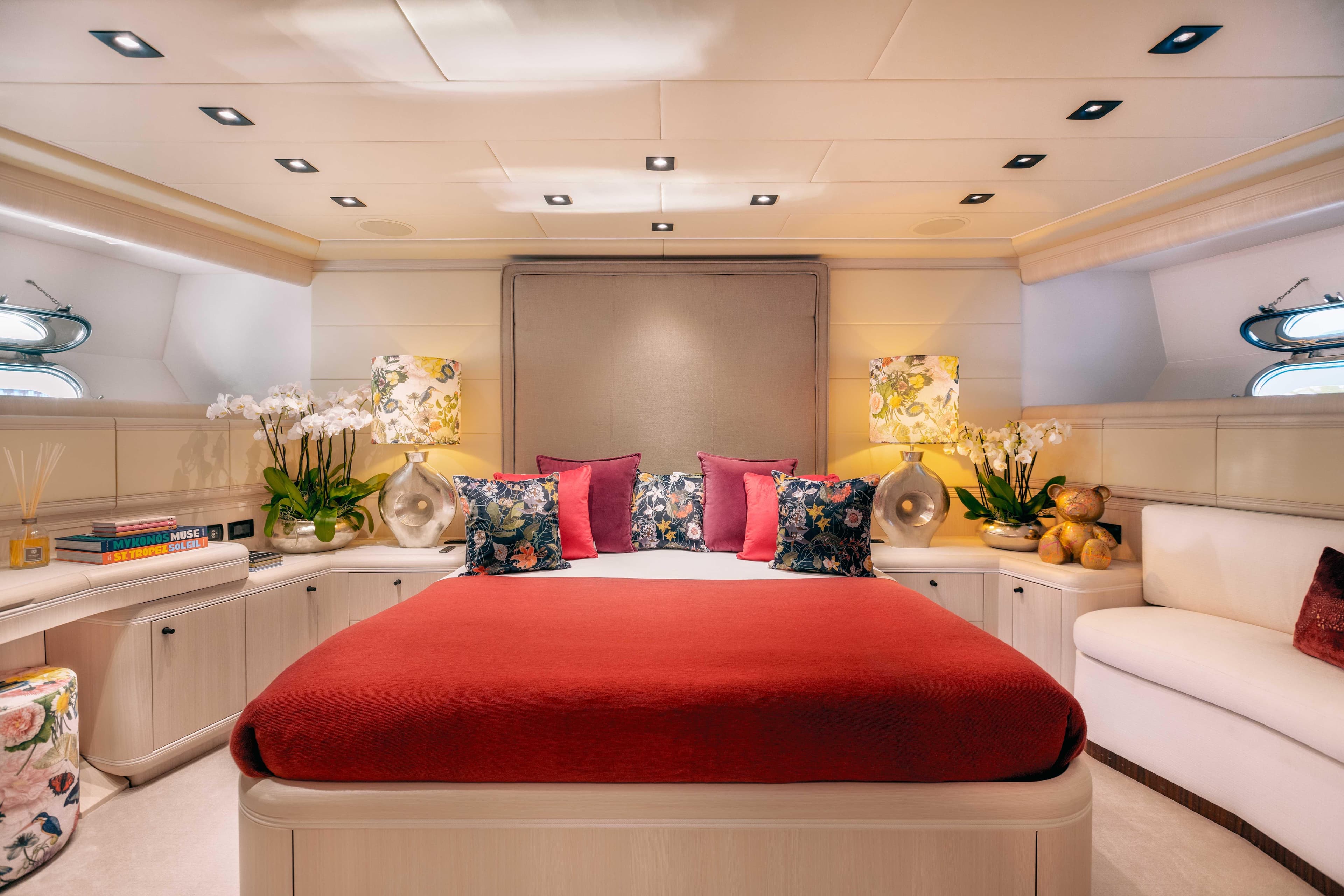 Luxurious bedroom on a 2004 Mangusta 130 yacht.
