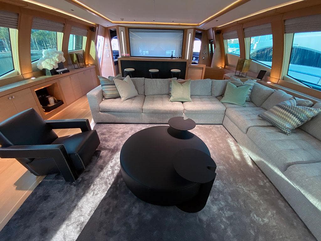 Luxurious interior of a 2005 Palmer Johnson 120 yacht with modern seating and elegant decor.