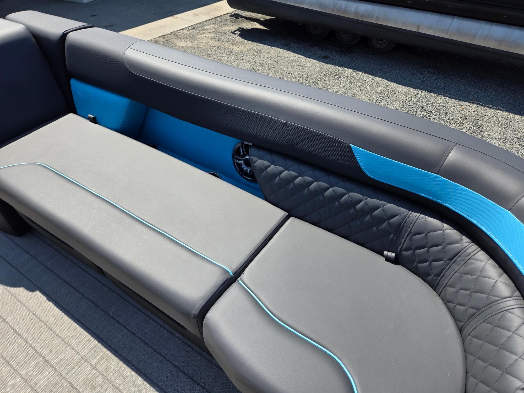 2025 Godfrey Sweetwater 2486 SB boat seating with sleek gray and blue upholstery.