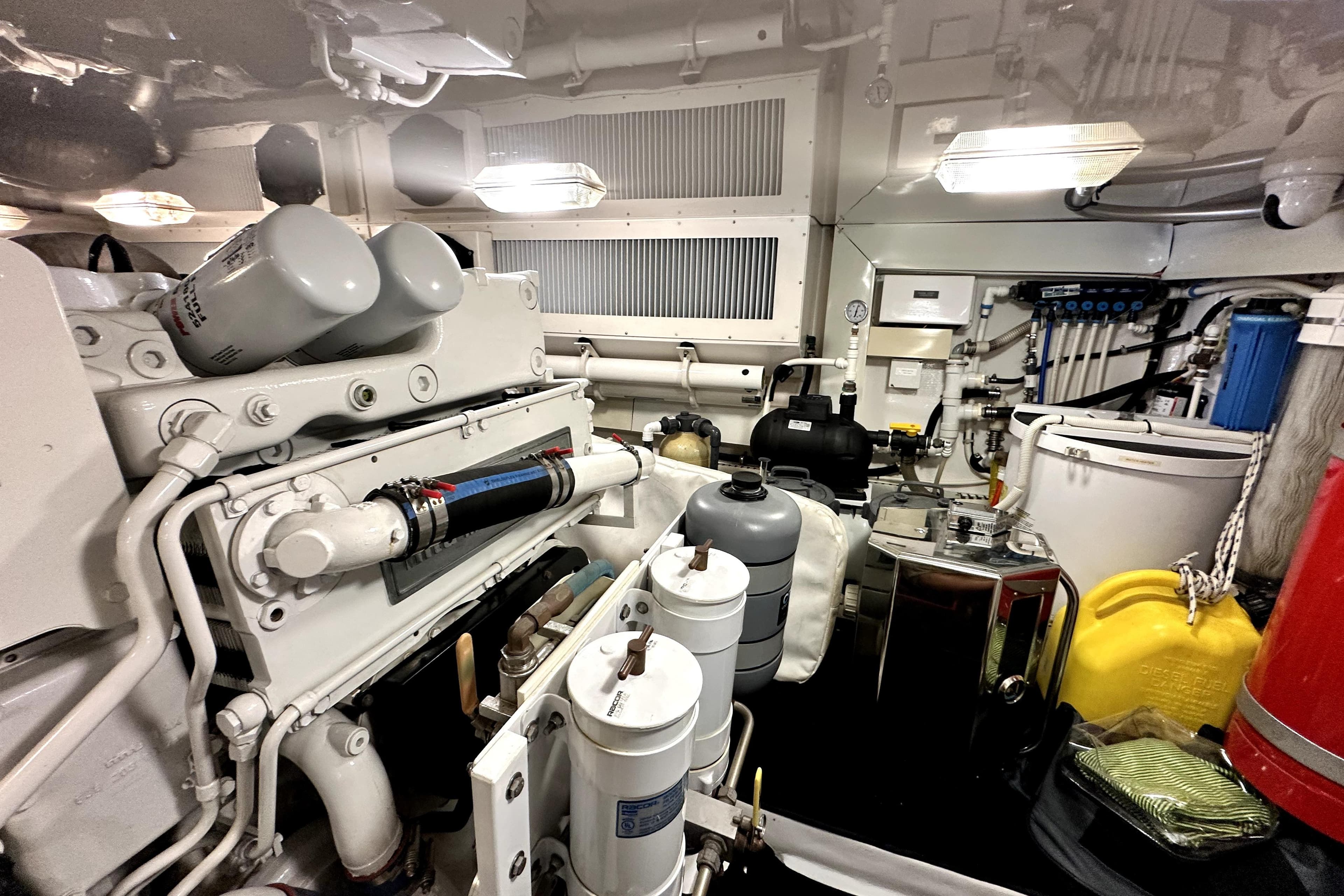 Engine room of a 2003 Viking 61 Convertible yacht, showcasing machinery and equipment.