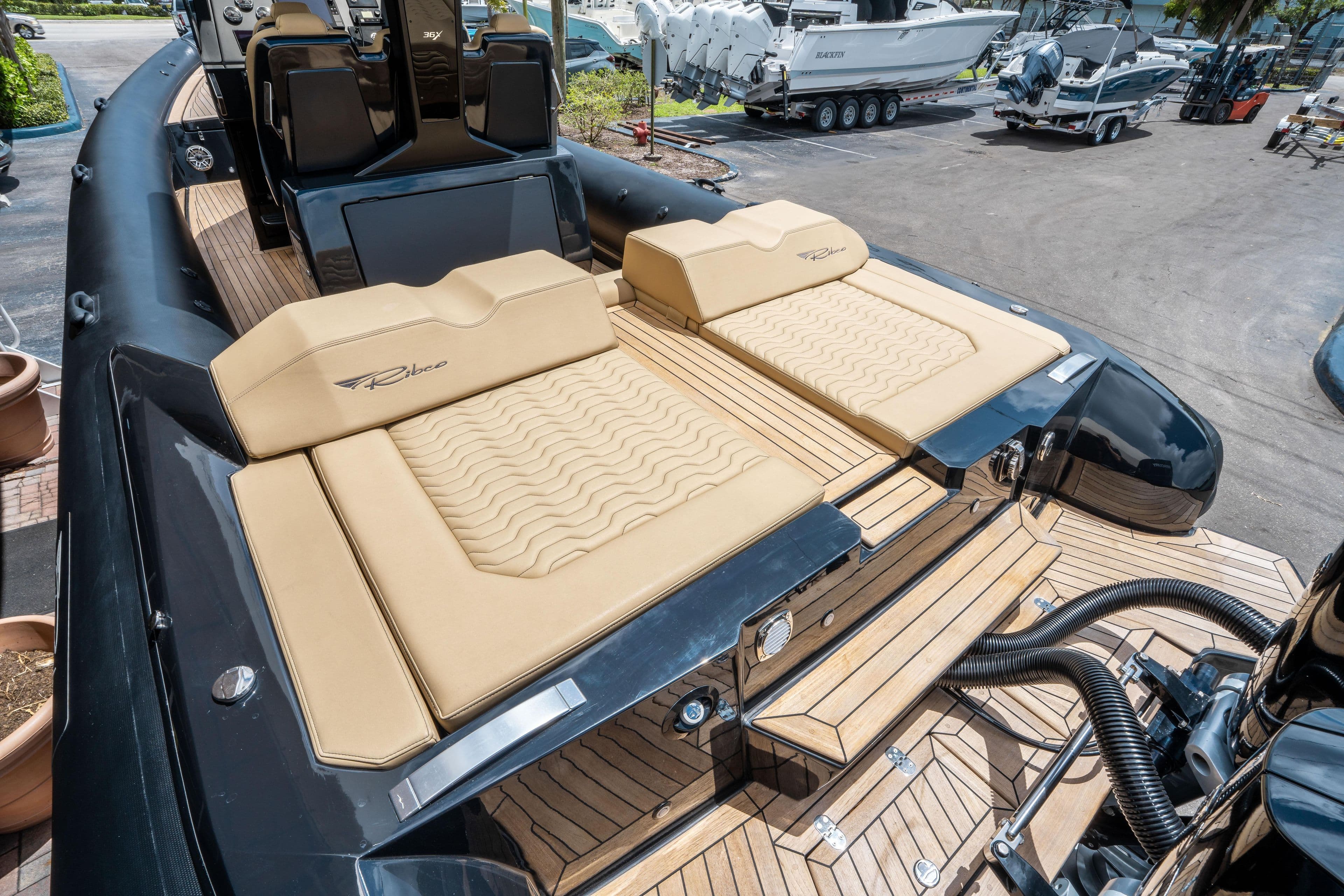 2023 Ribco Seafarer 36 X luxury boat with tan seating and sleek design.