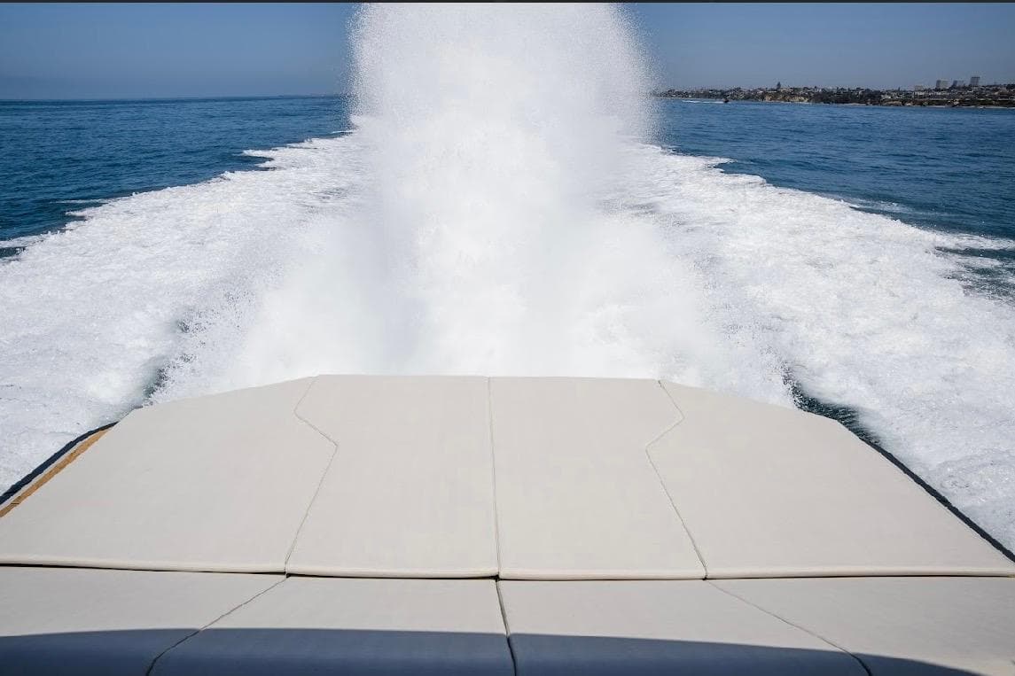 2025 Maori 54ft XL yacht cruising, leaving a foamy wake in the ocean.