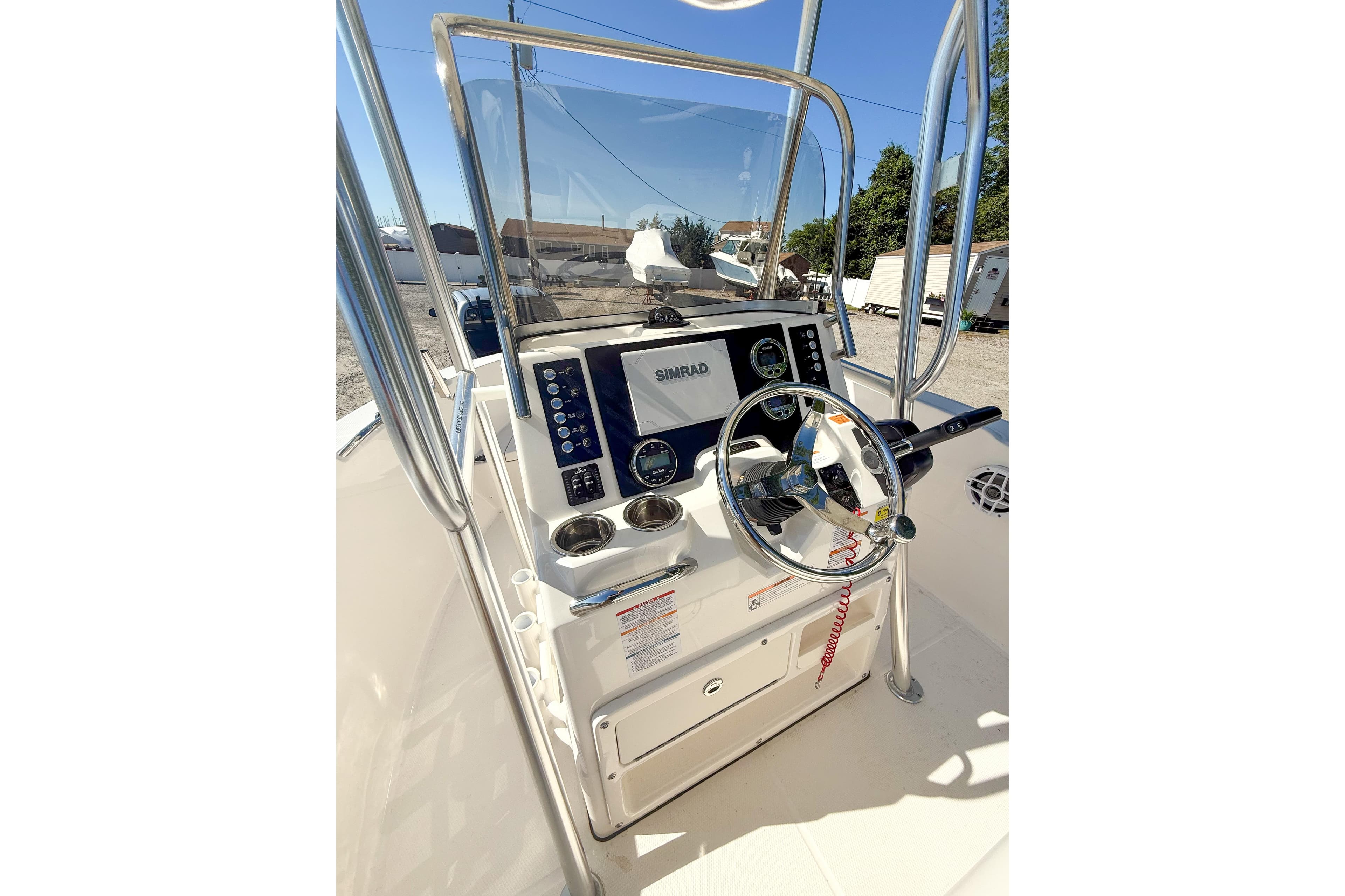 2024 Robalo R180 Center Console boat dashboard with steering wheel and navigation system.