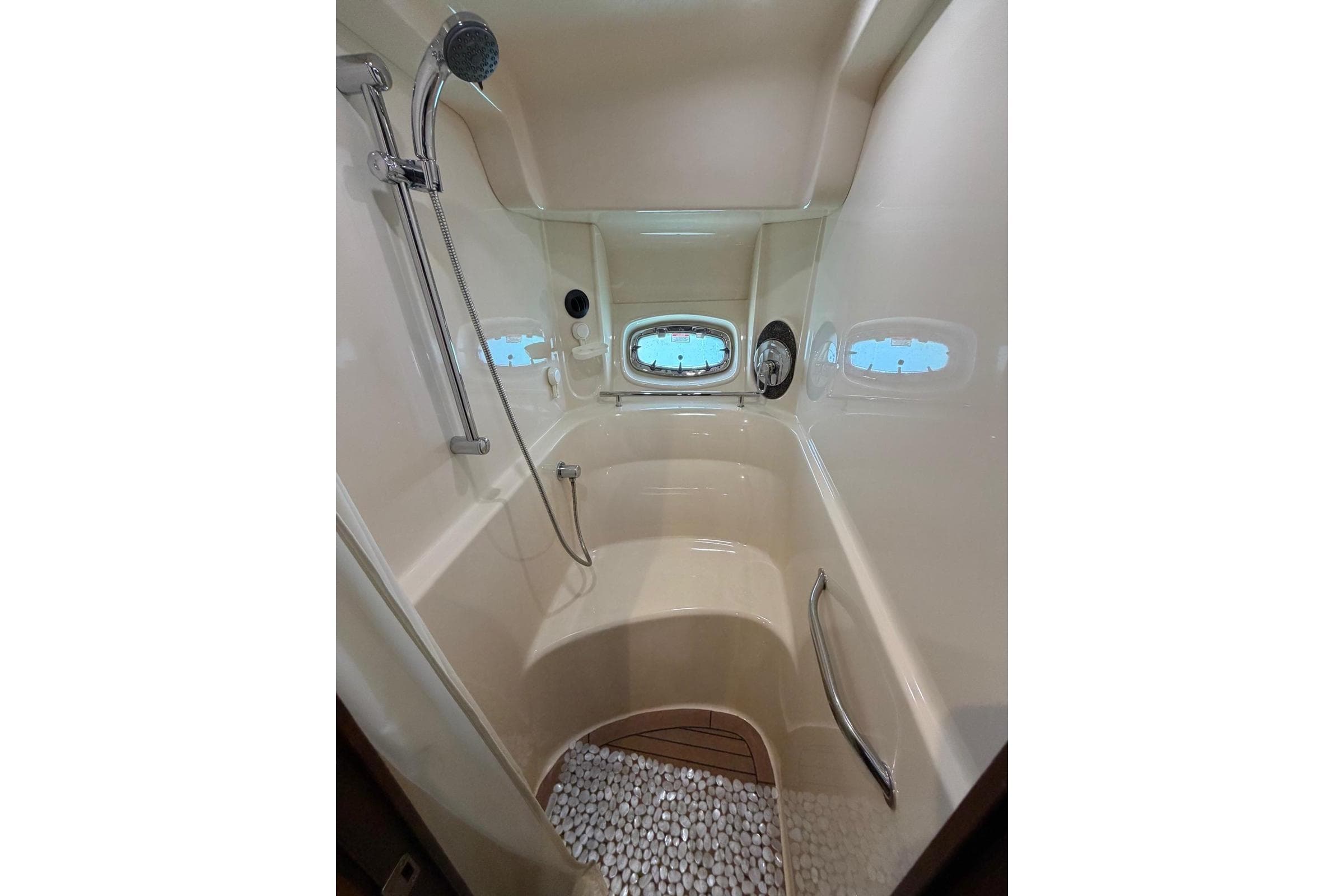 Luxurious shower area in 2006 Sea Ray 480 Sundancer yacht with modern fixtures.