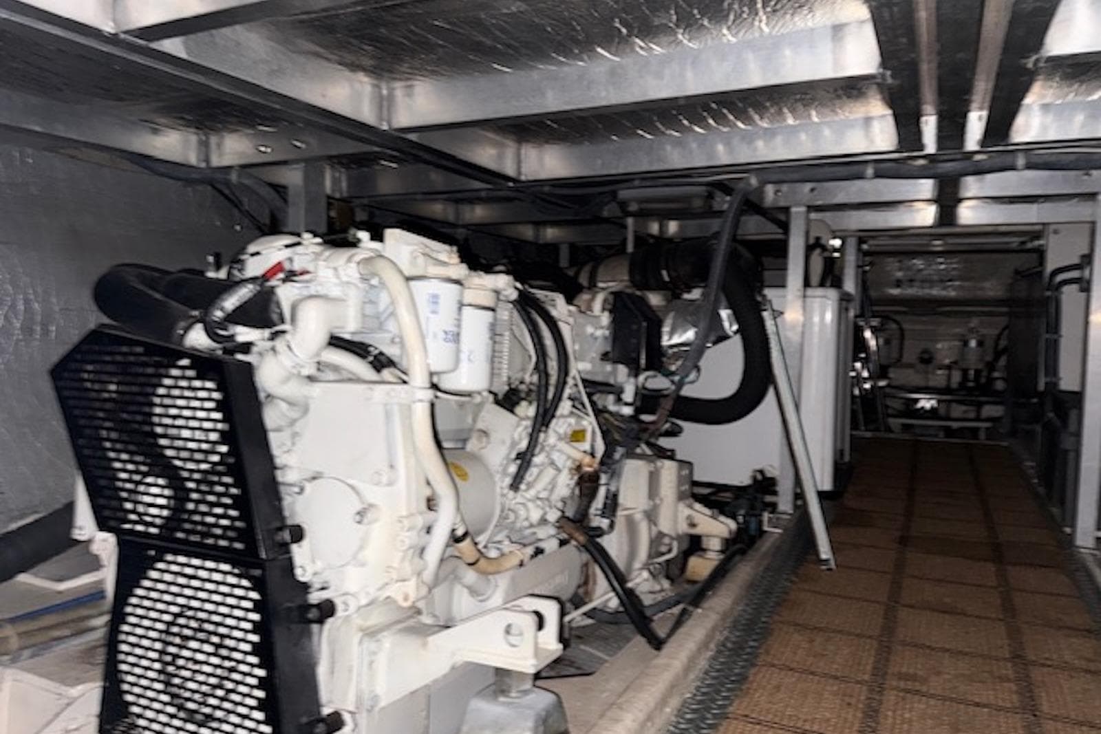 Engine room of 2006 Navigator 53 Extended Deckhouse yacht, showcasing machinery and equipment.