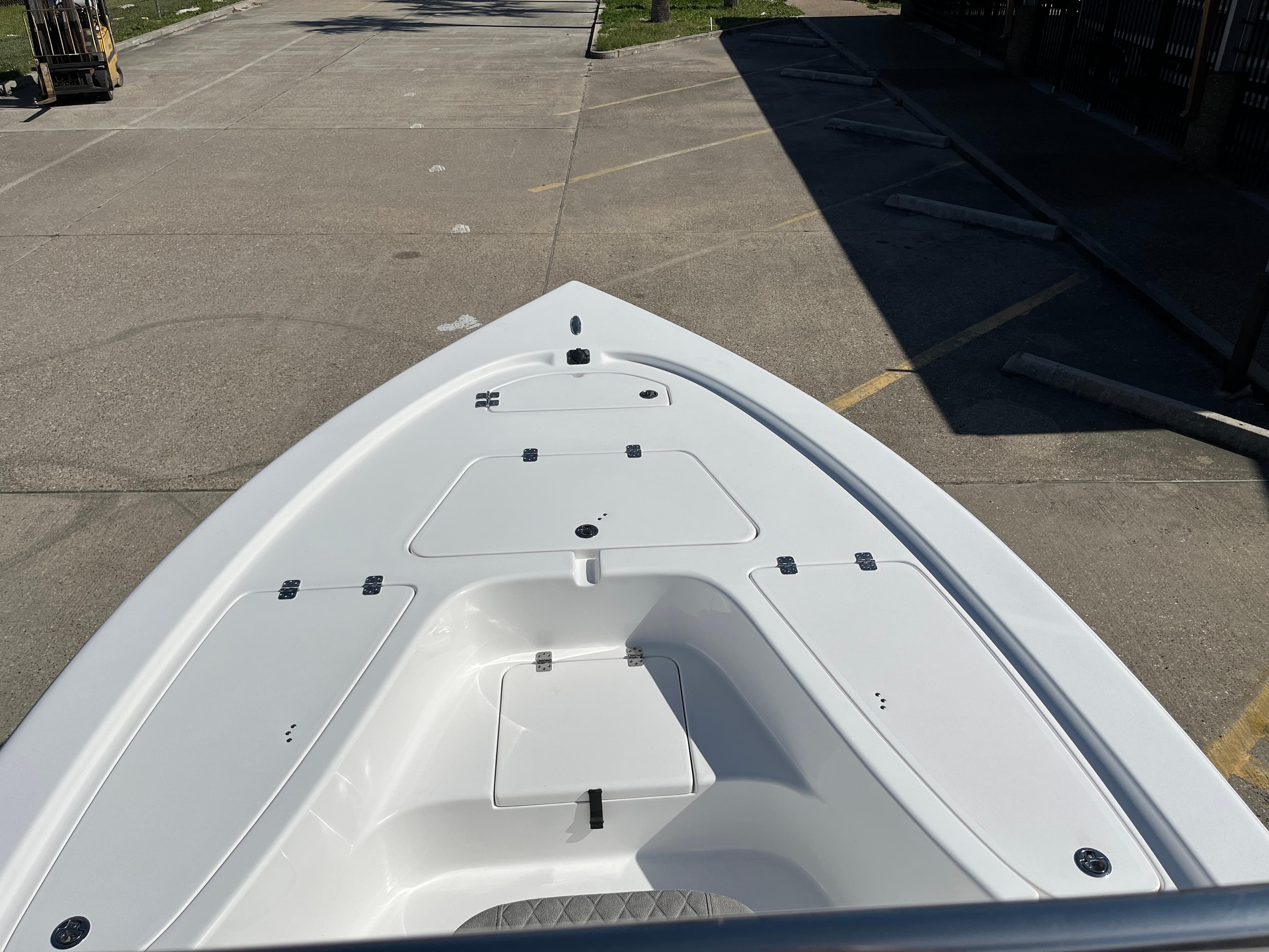 2024 Sea Pro 230 Bay boat bow view in a parking lot.