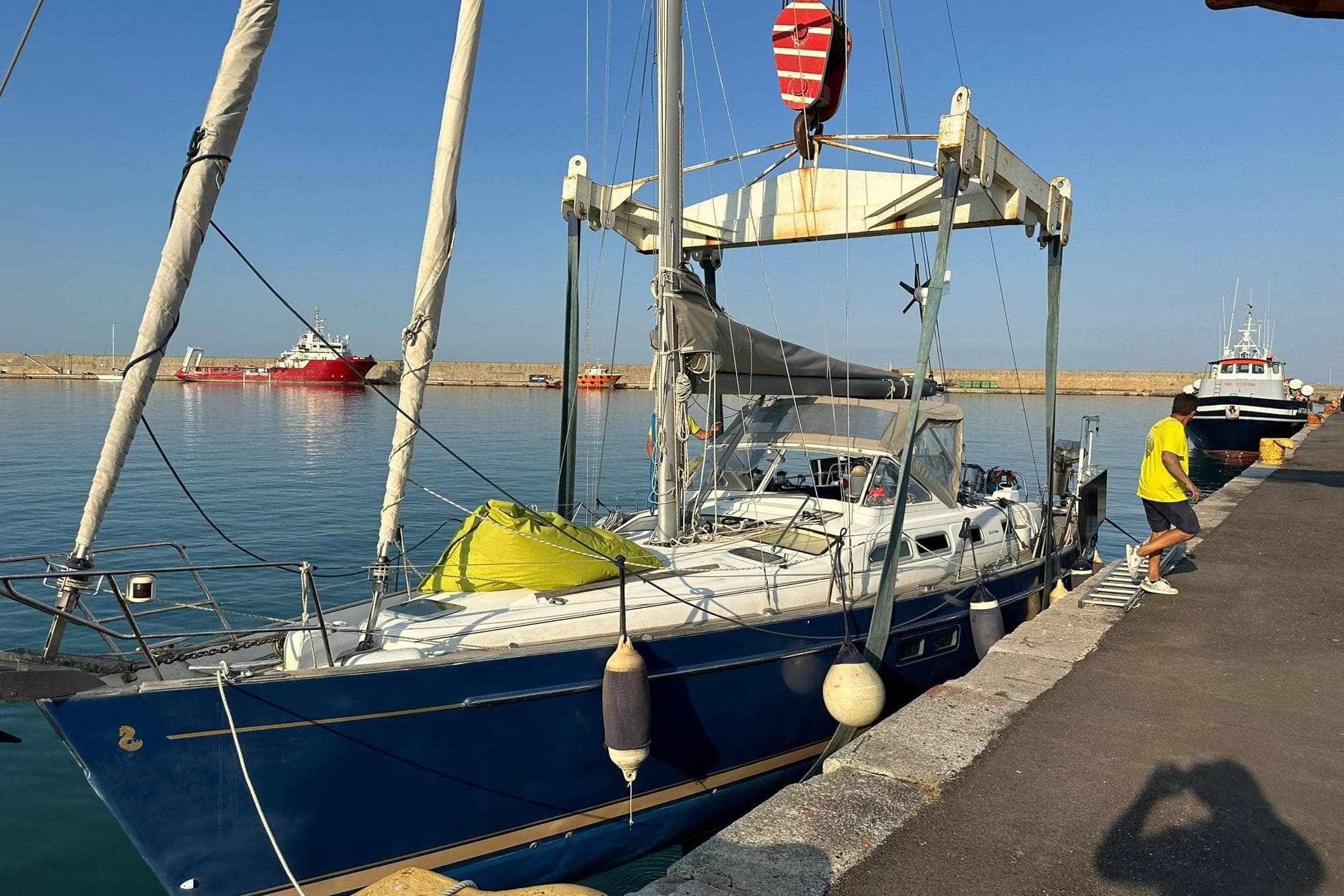 2004 Beneteau Oceanis 42CC sailboat docked at a marina with clear skies.