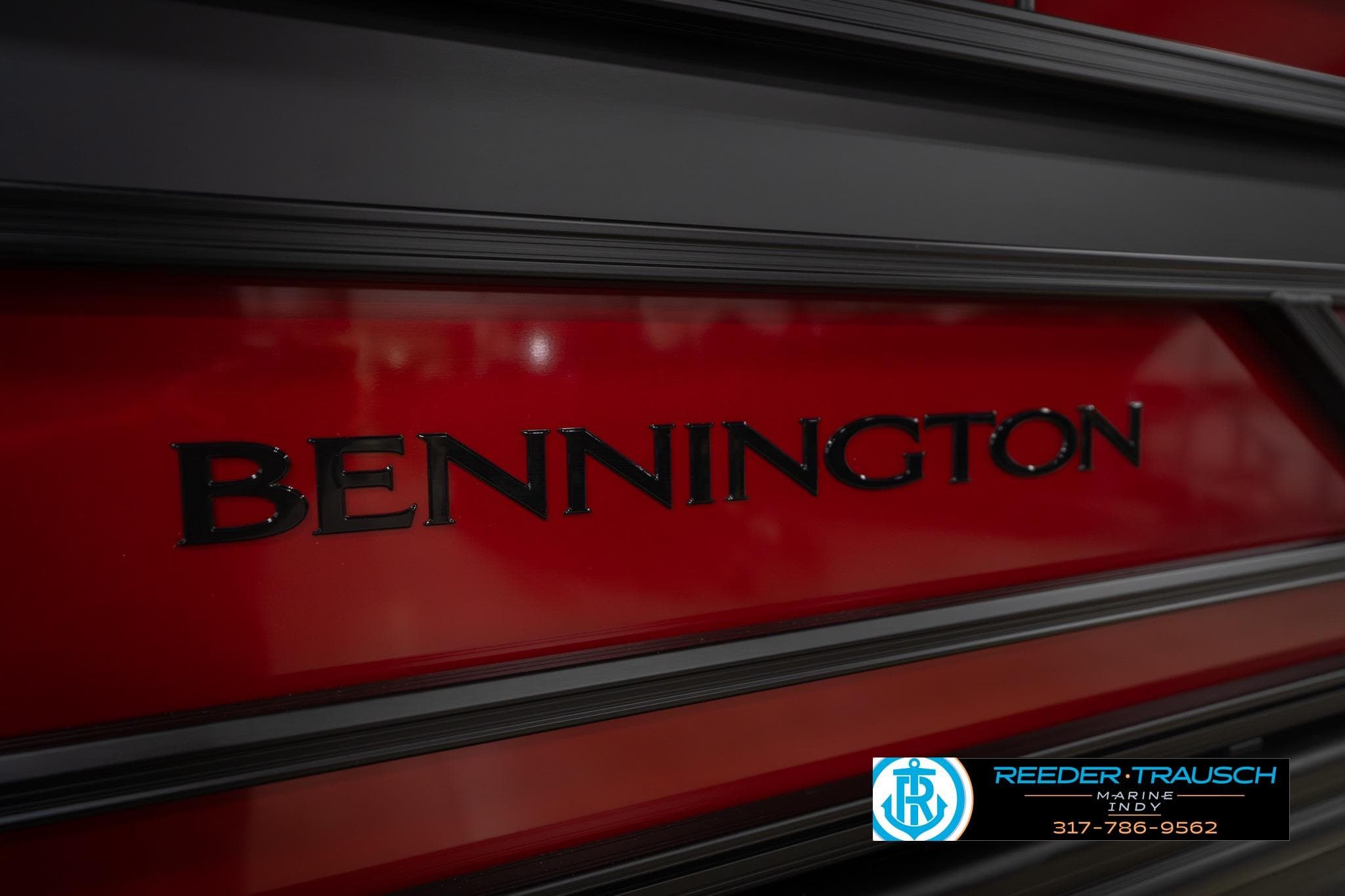 2026 Bennington 22 SLJ boat with red and black detailing, Reeder-Trausch Marine logo.