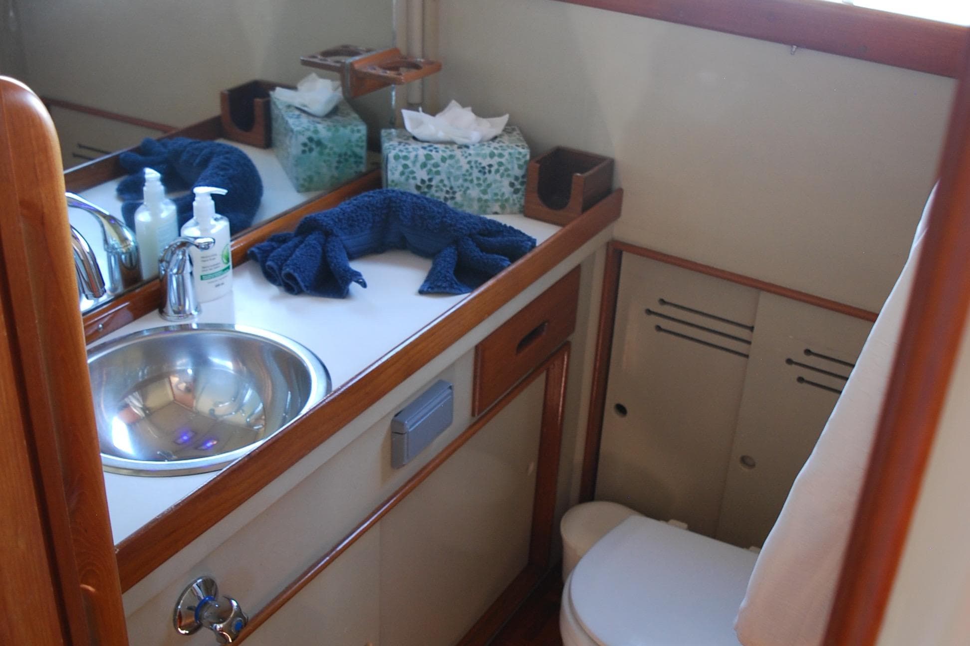 Bathroom interior of 1971 Grand Banks 36 Classic yacht with sink and toilet.