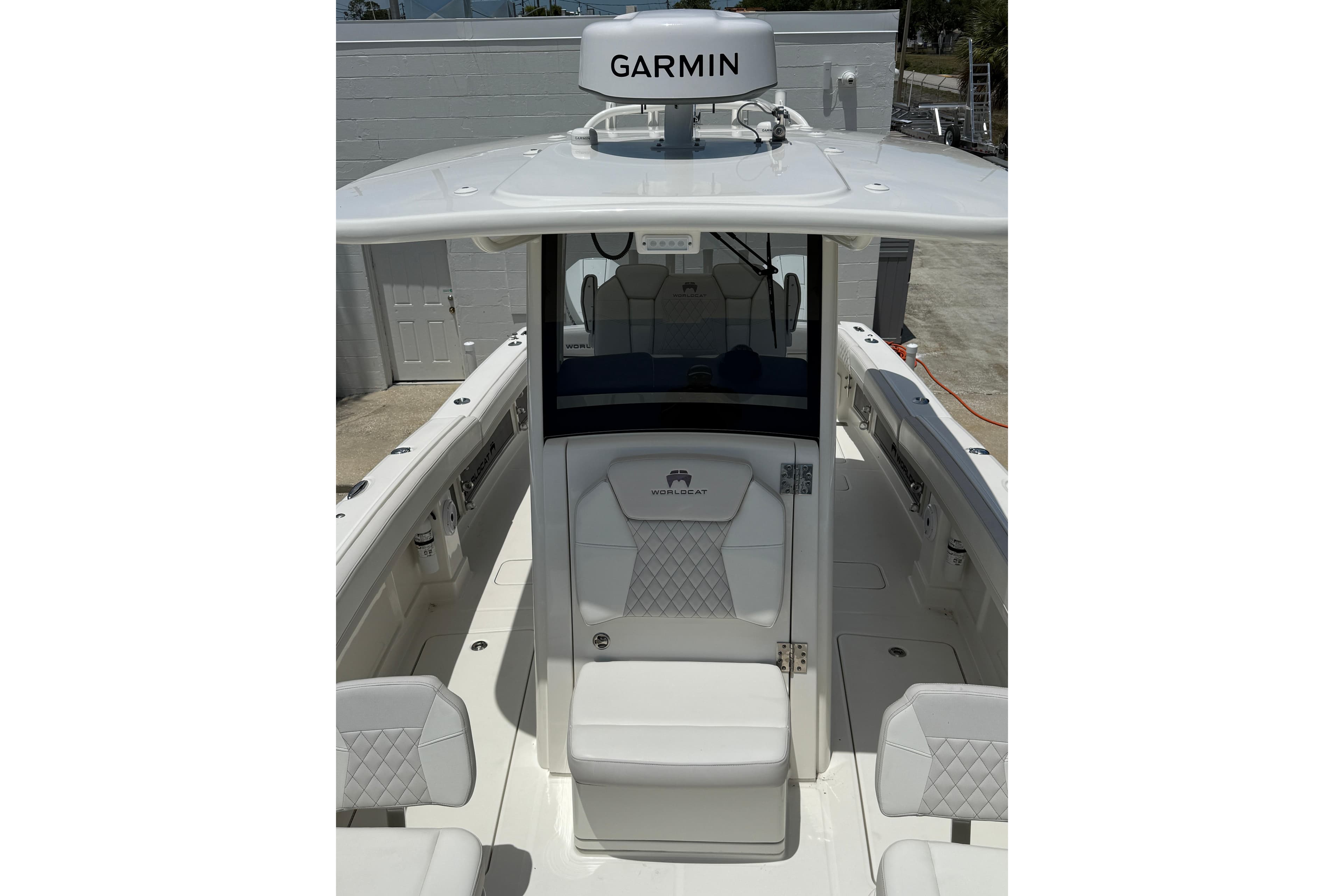 2024 World Cat 280 CC-X boat interior with Garmin equipment, featuring white seating and modern design.