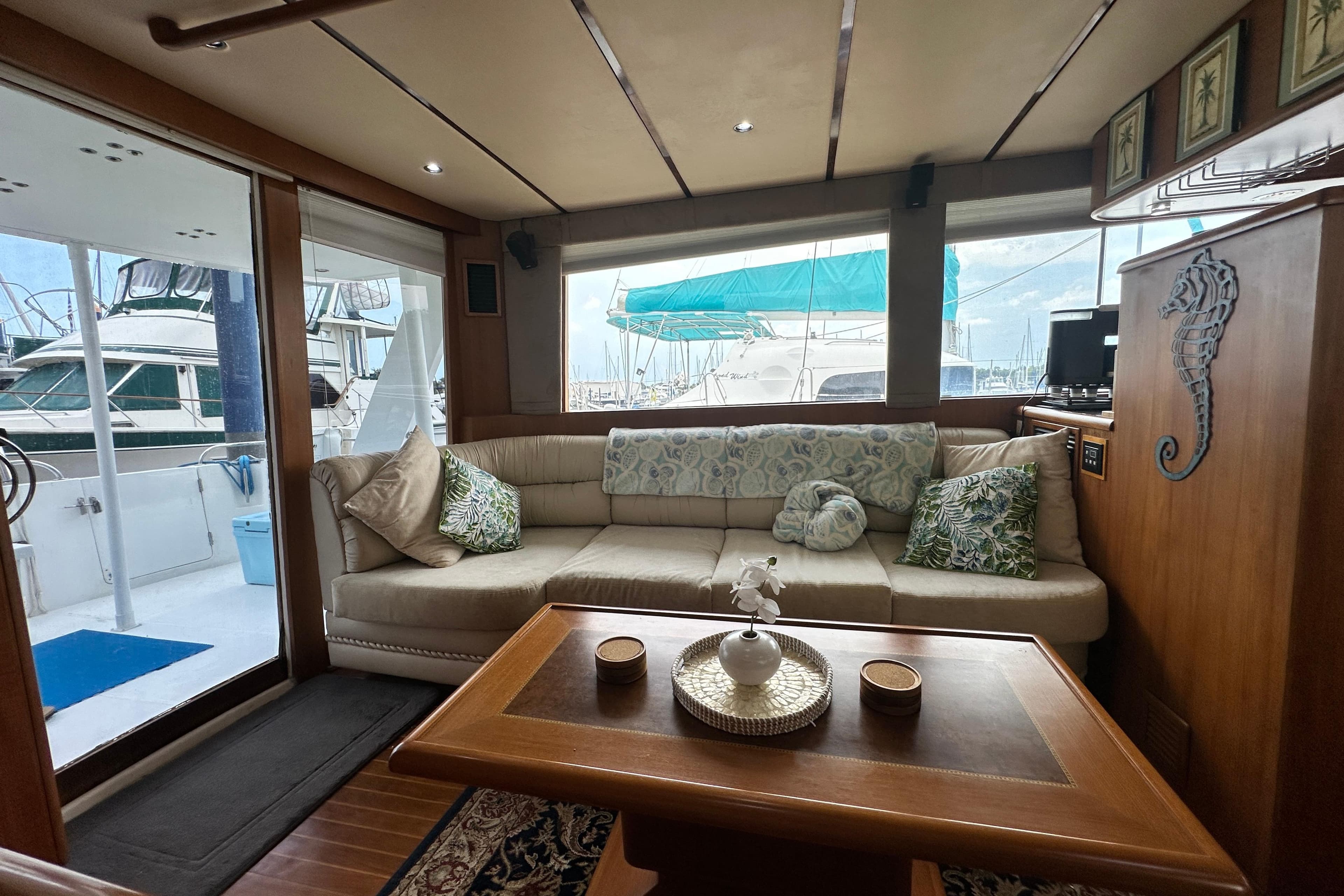 Interior of 2001 Prima 52 Seahorse yacht with cozy seating and nautical decor.
