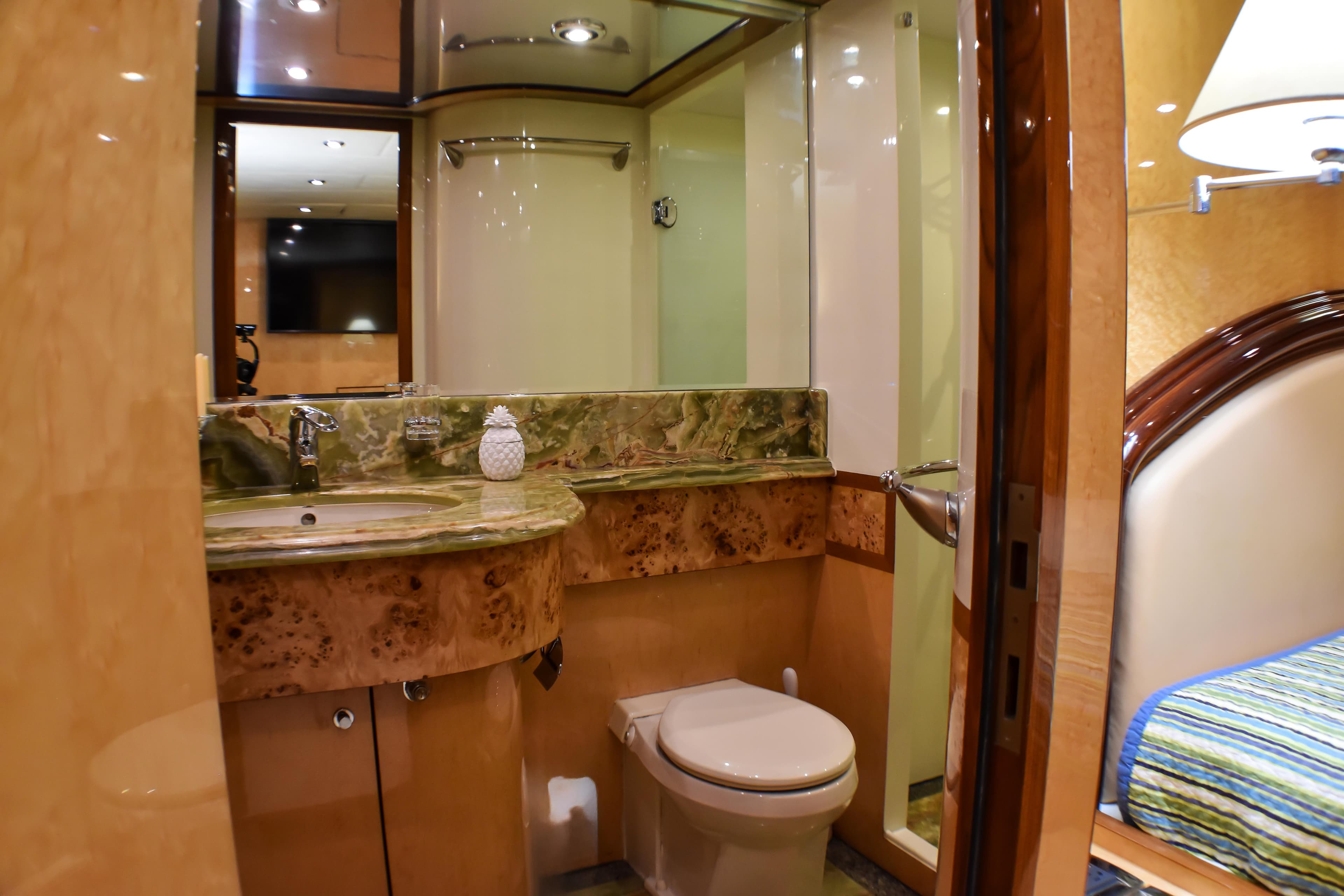 Luxurious bathroom in 2006 Johnson Country Kitchen yacht with marble countertop and modern fixtures.