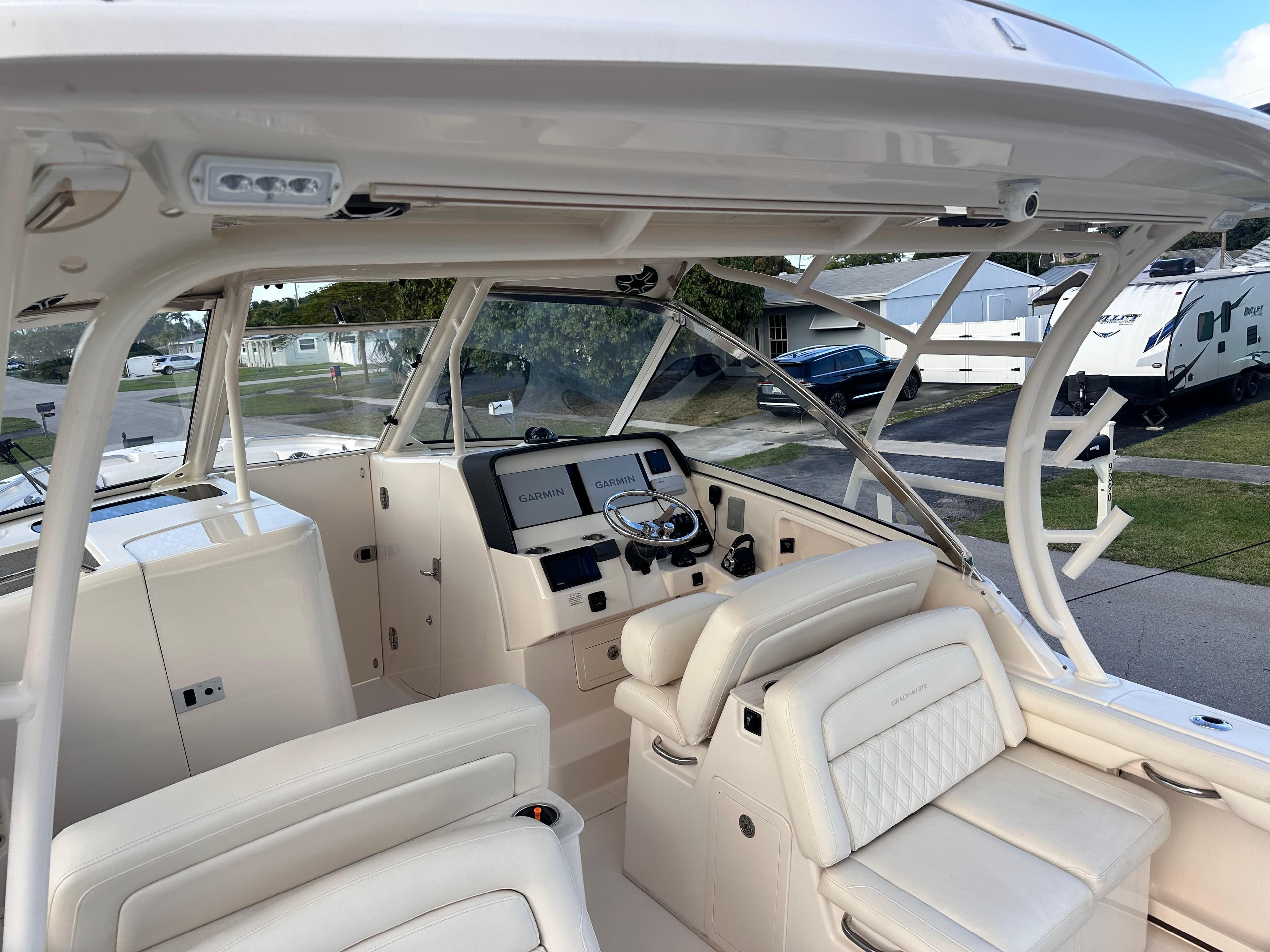 2019 Grady-White Freedom 325 boat interior with helm, seating, and navigation equipment.