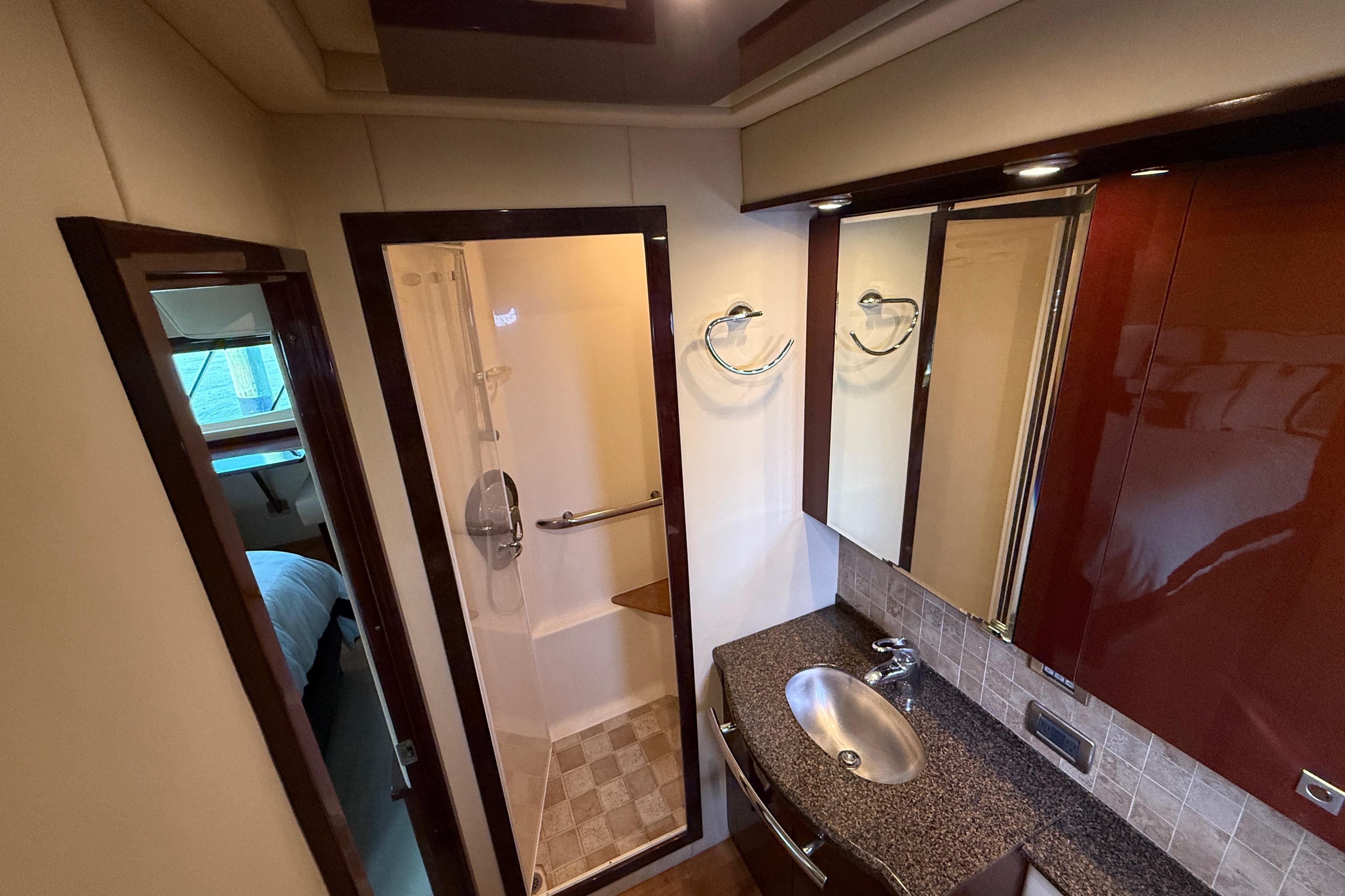 Luxurious bathroom interior of 2008 Sea Ray 550 Sundancer yacht with modern fixtures.