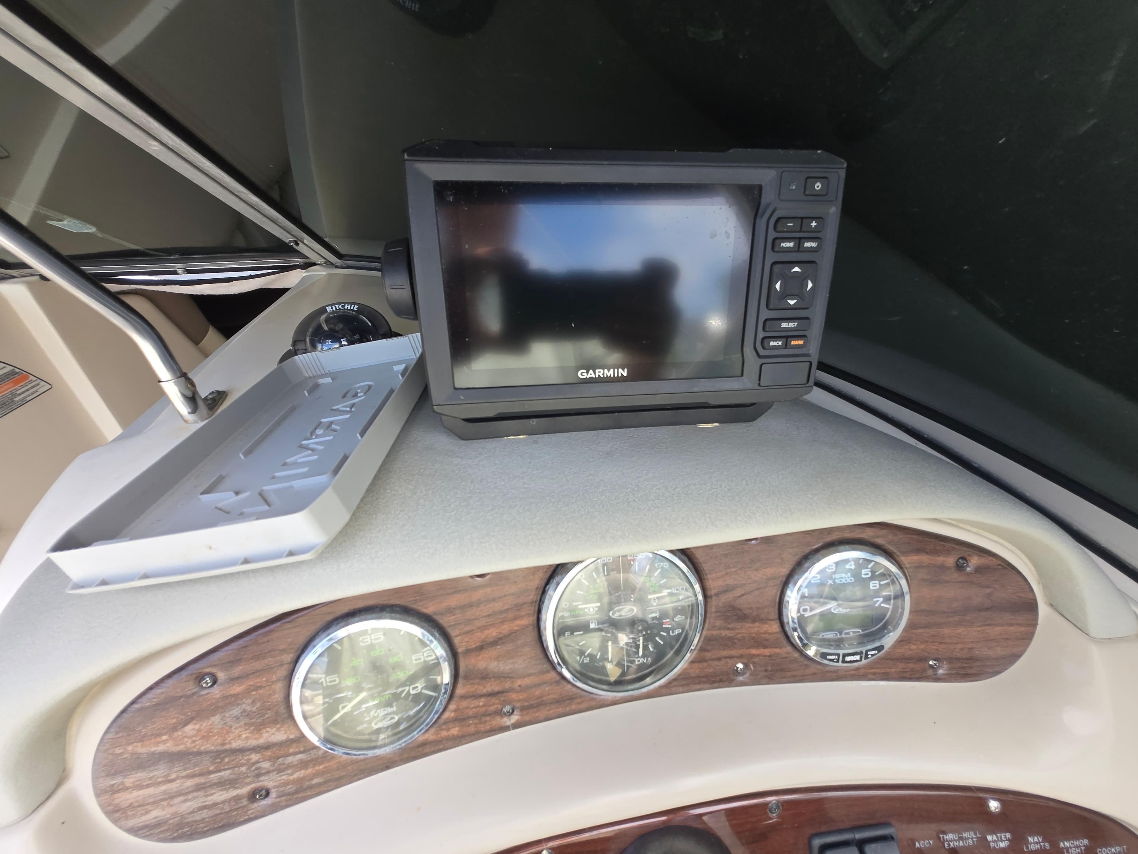 Dashboard of 2006 Sea Ray 270 Sundeck with Garmin GPS and gauges.