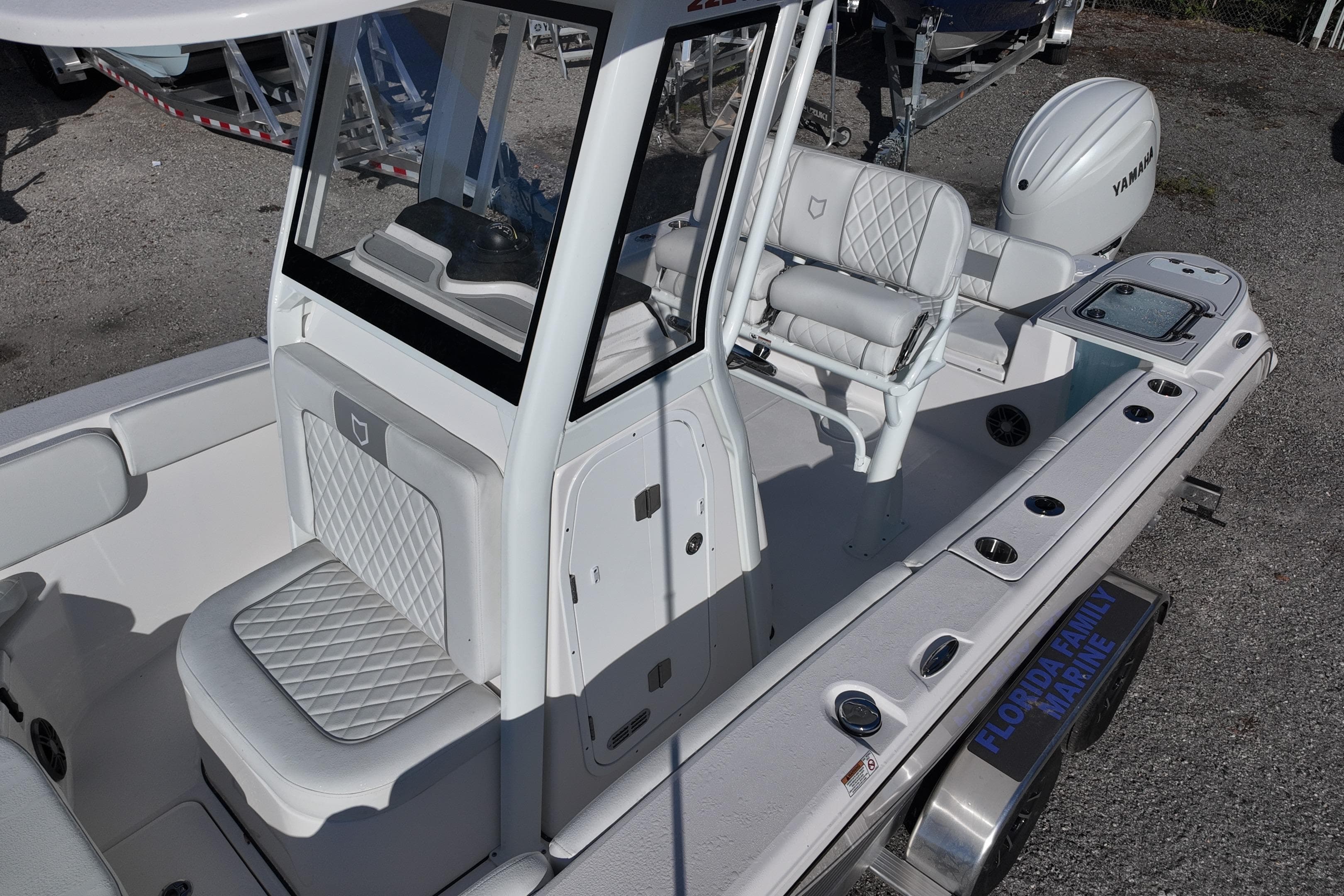 2026 Sea Fox 228 Commander boat interior with white seating and Yamaha engine.