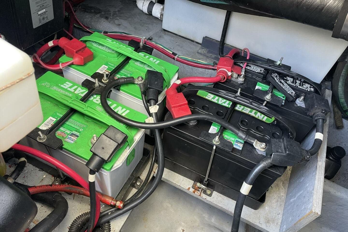 Battery setup in a 2000 Sea Ray 400 Sedan Bridge boat engine compartment.