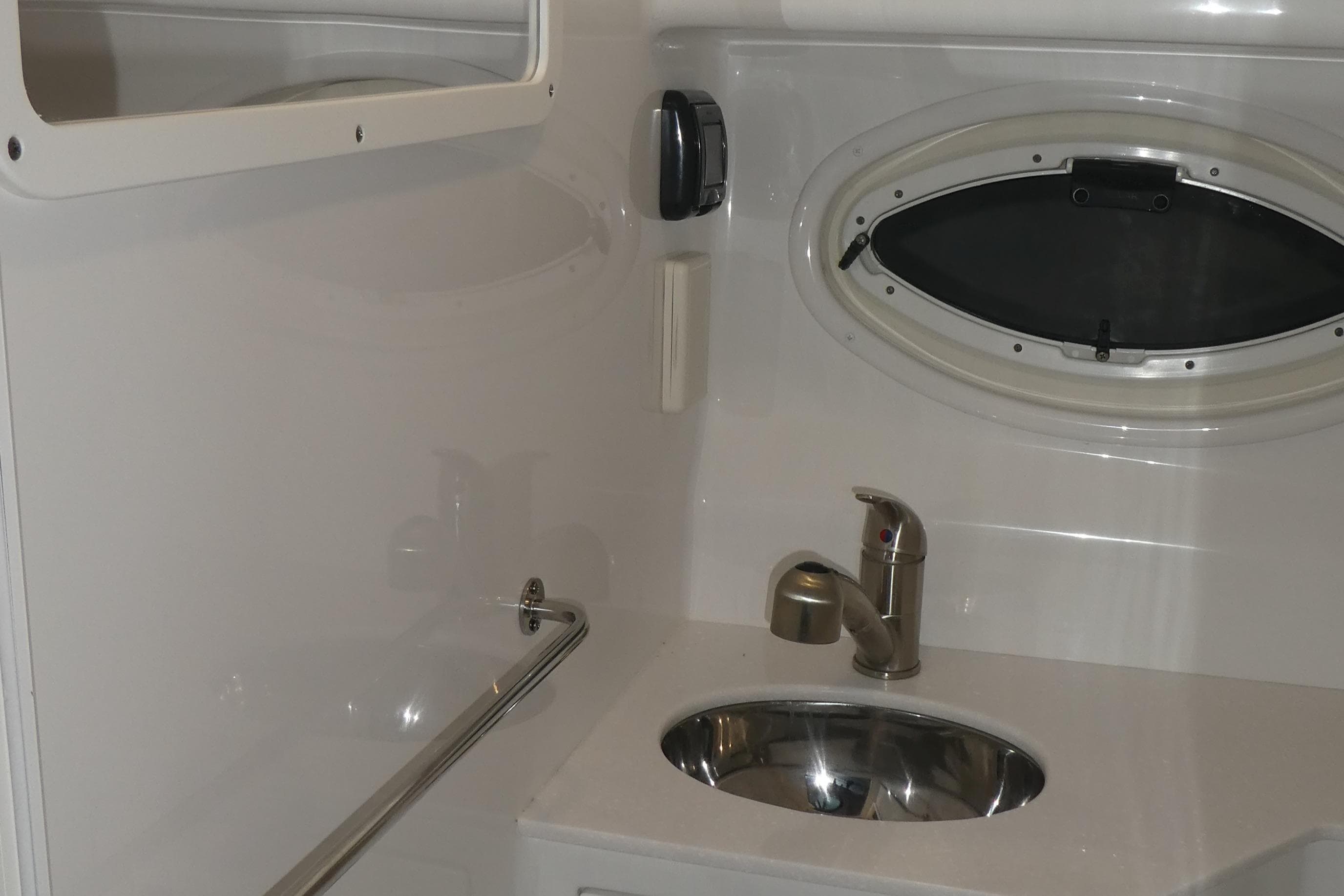 Interior of 2019 Monterey 295 Sport Yacht with sink and window.