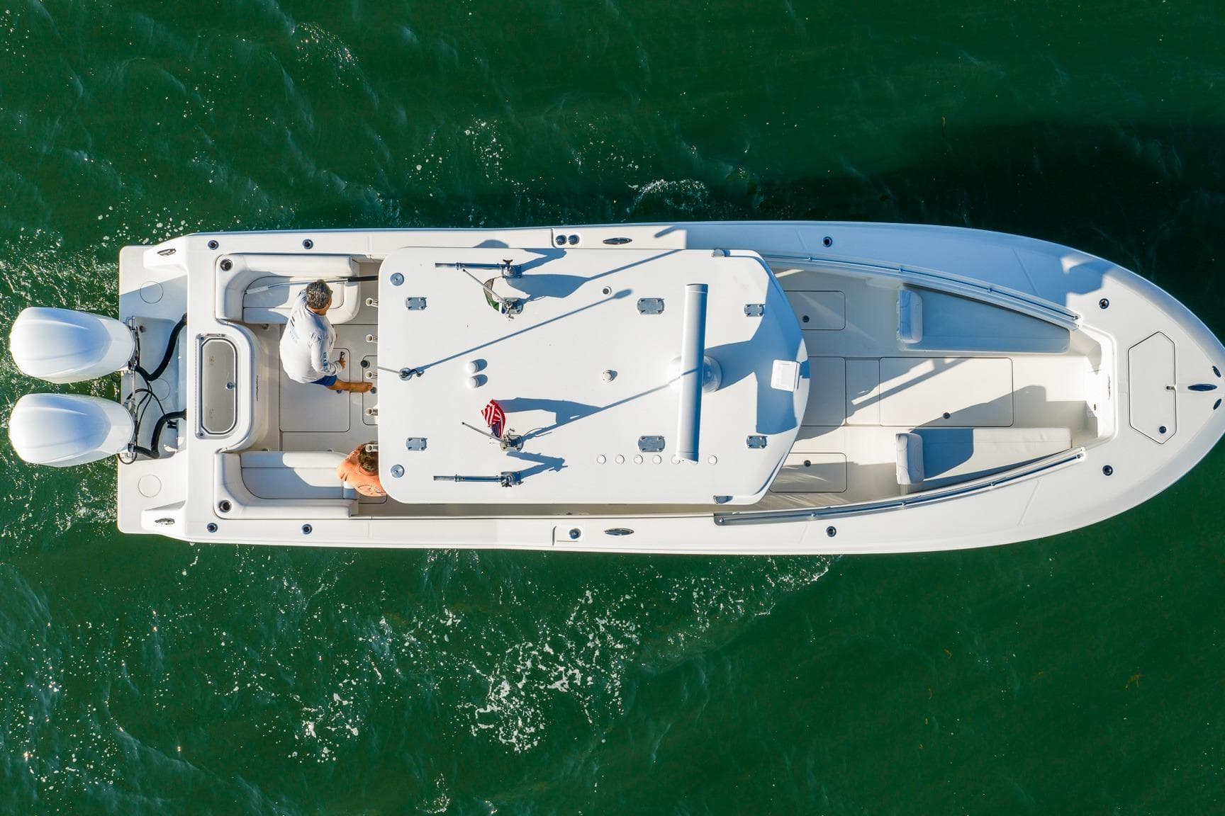 Overhead view of 2016 Invincible 33 Open Fisherman boat on green water.