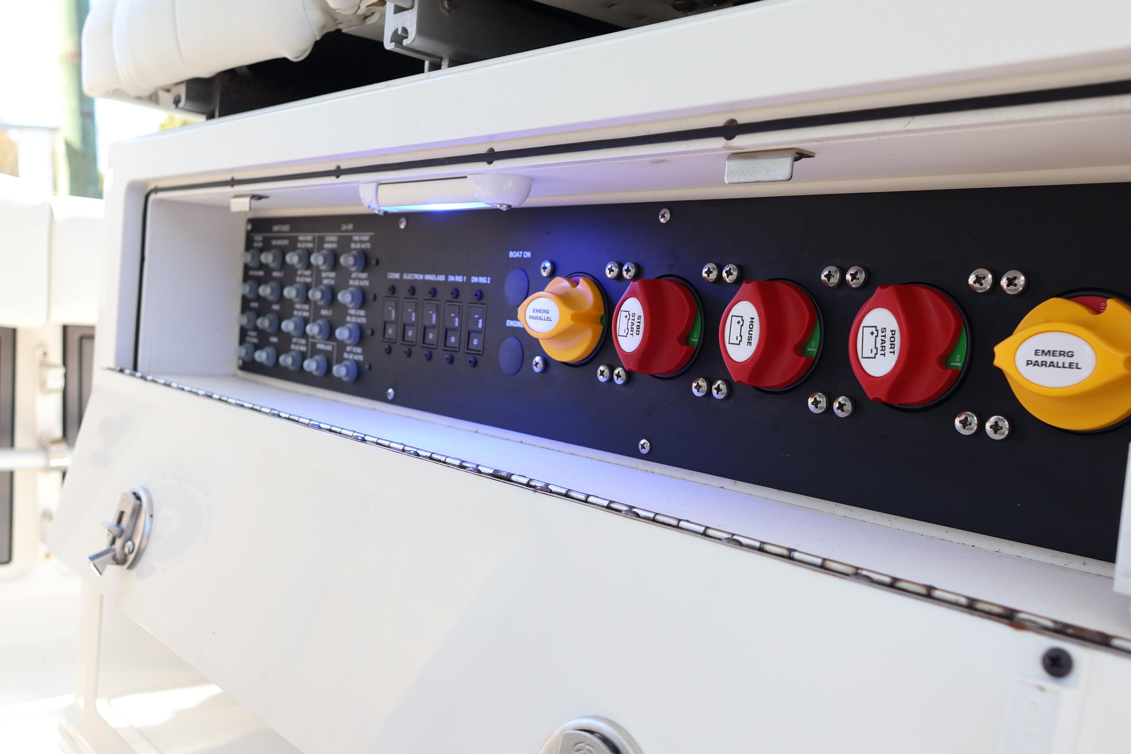 Control panel of 2022 World Cat 280 CC-X boat with switches and dials.