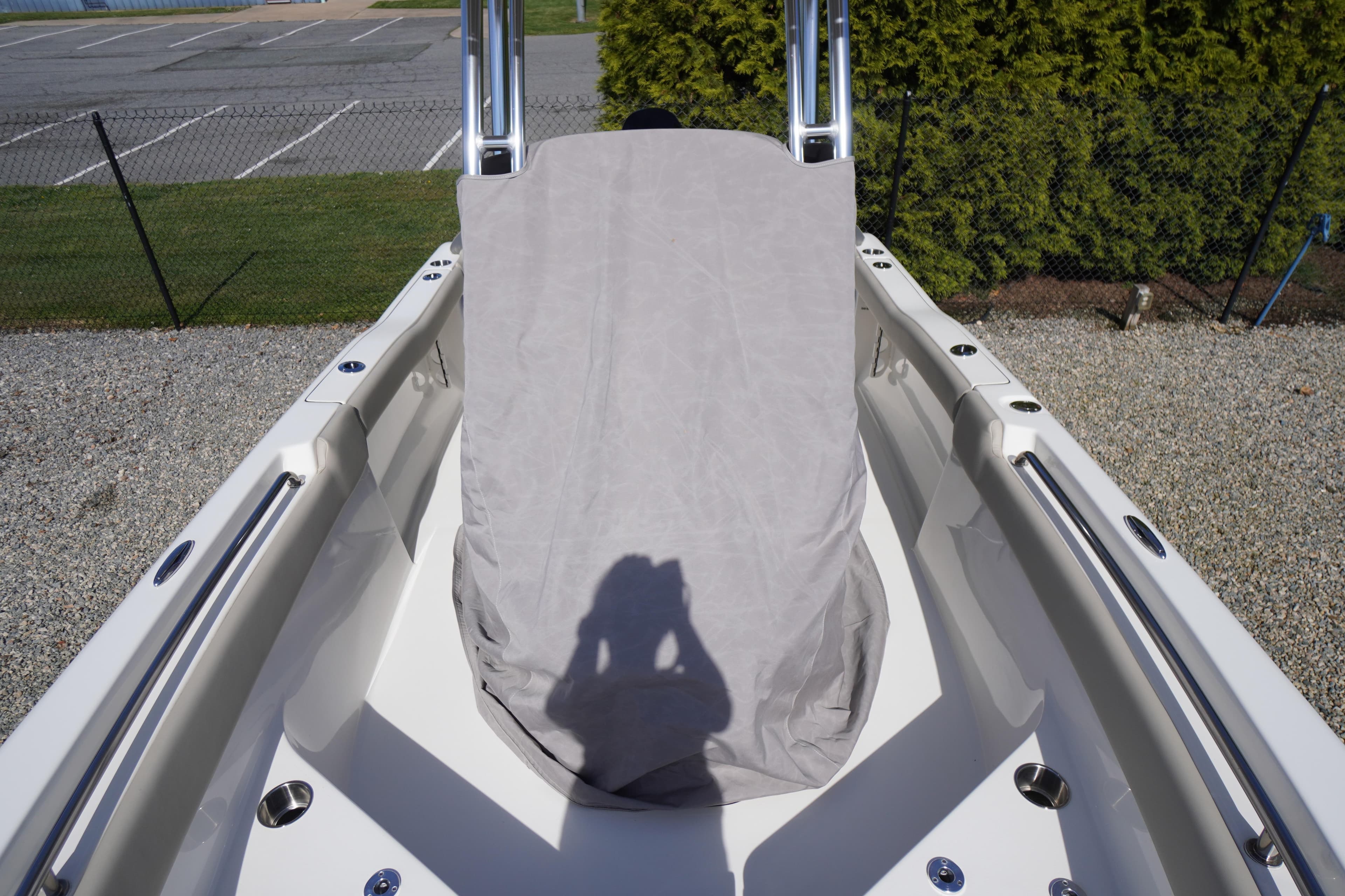 2025 Key West 203 FS boat interior with covered console, parked outdoors.