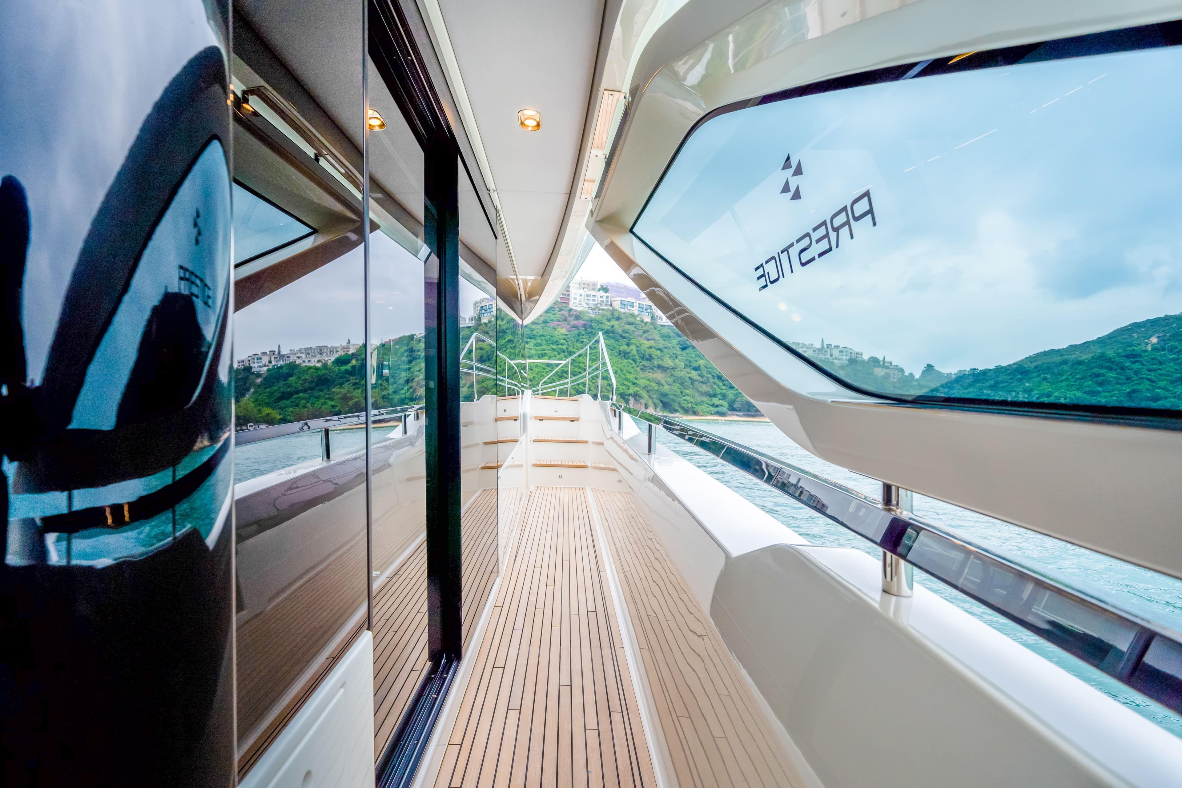 Luxurious Prestige M8 yacht deck with sleek design, showcasing modern elegance and scenic views.