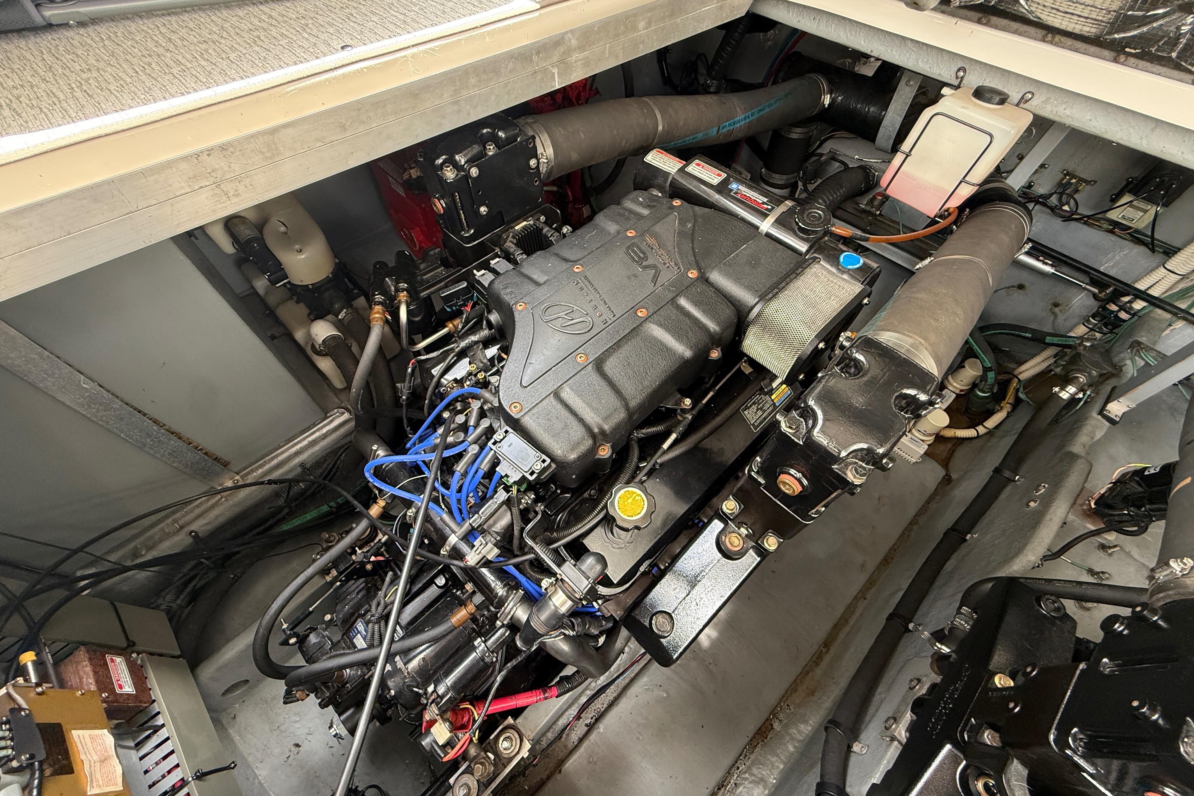 Engine compartment of a 2000 Sea Ray 410 Sundancer boat, showcasing mechanical components.