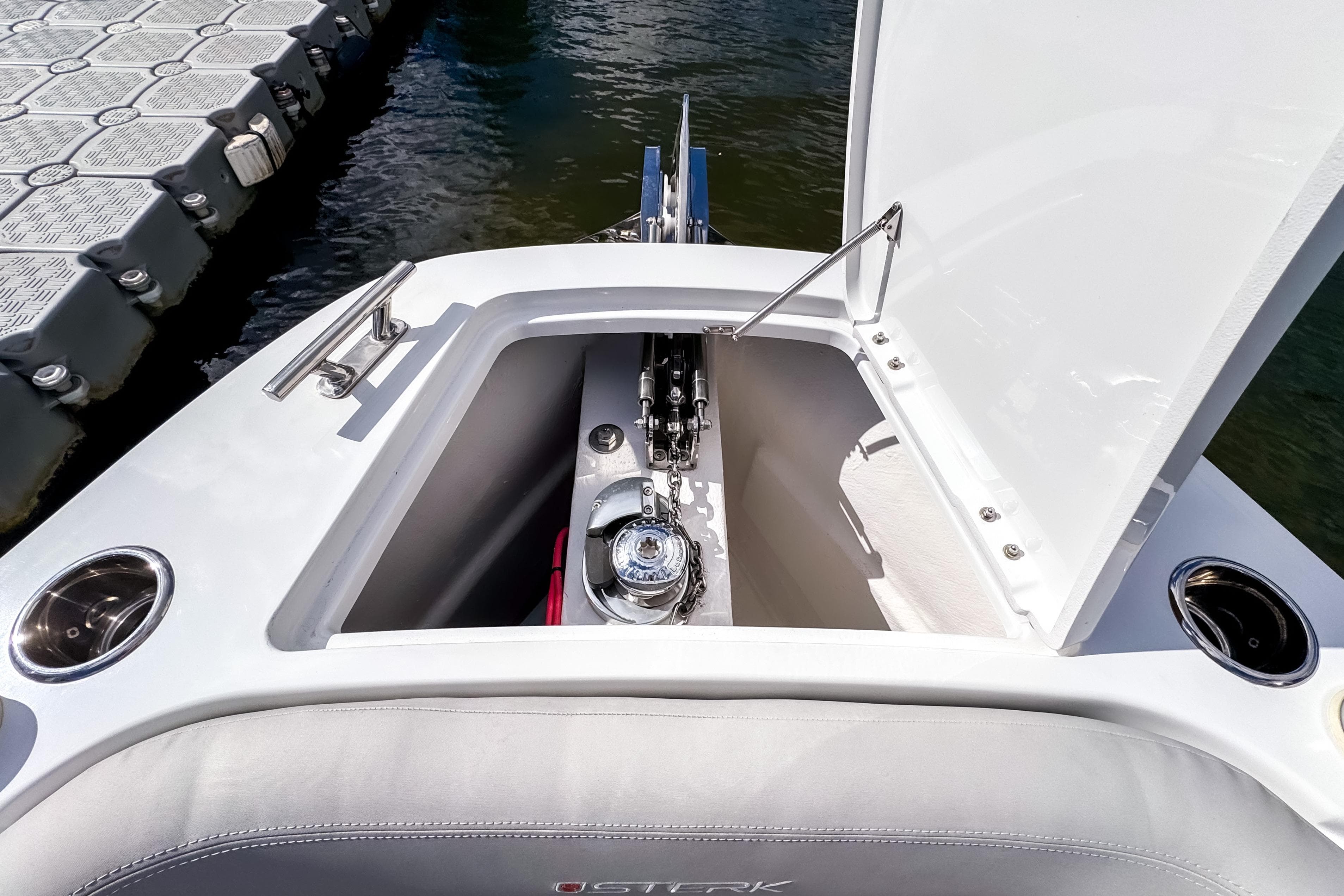 Open anchor compartment on 2025 STERK 31 boat, dockside view.