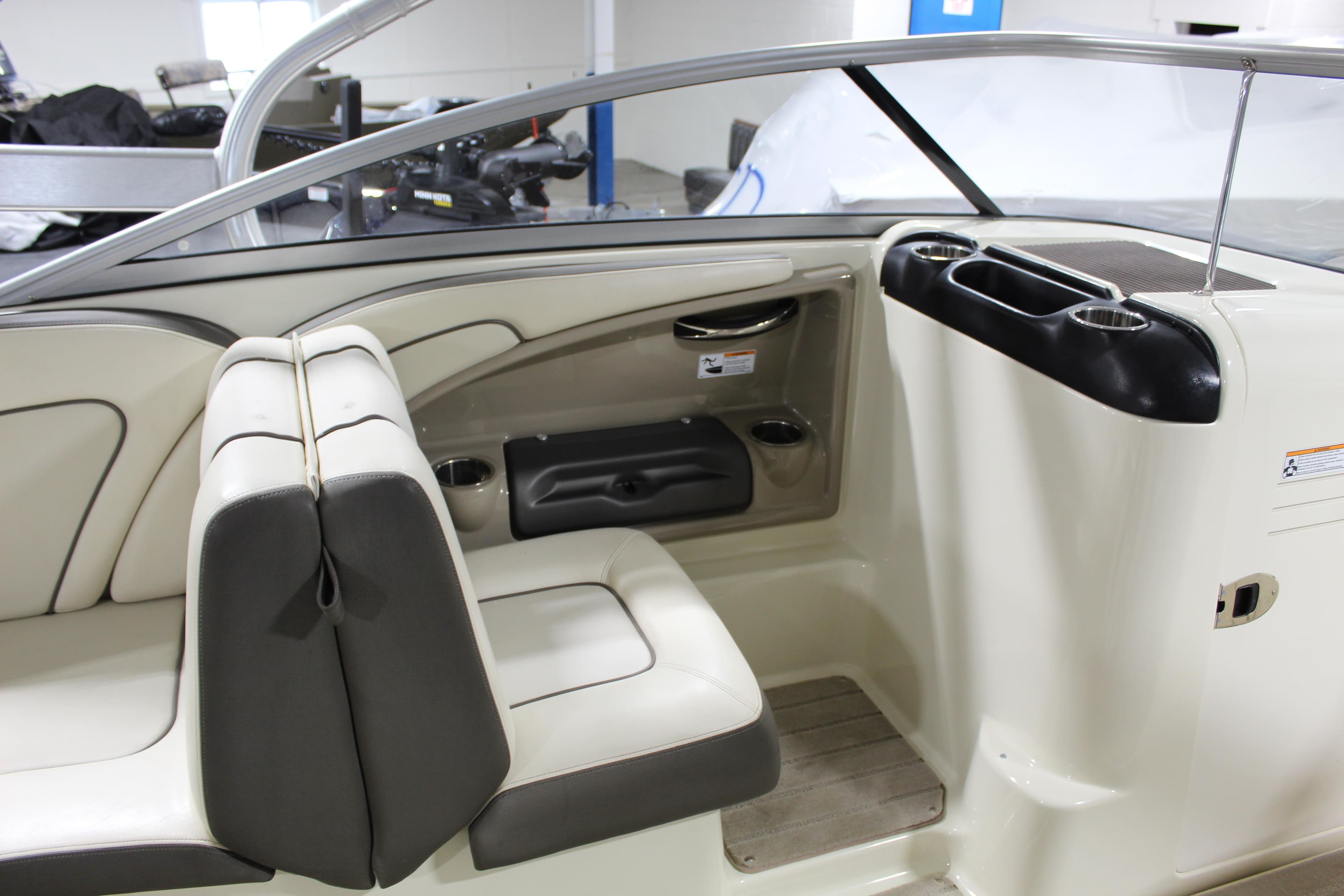 2014 Yamaha Boats 242 LTD S interior with beige and gray seating.
