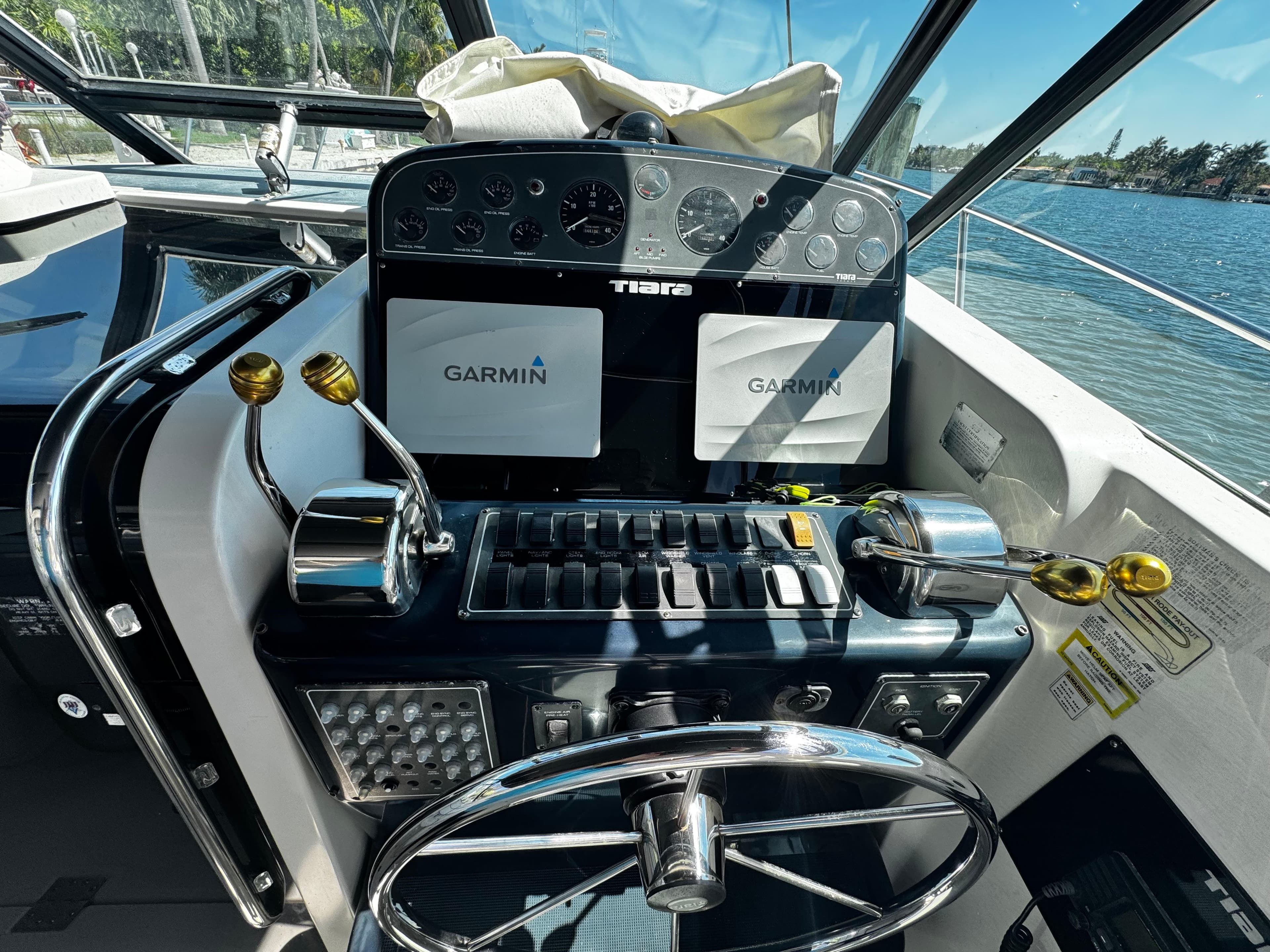 Helm of 2000 Tiara Yachts 3500 Open with Garmin navigation systems.