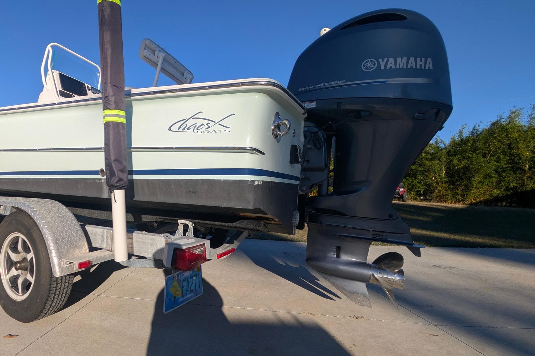 2017 Chaos 21 Tarpon Bay boat on trailer with Yamaha outboard motor.