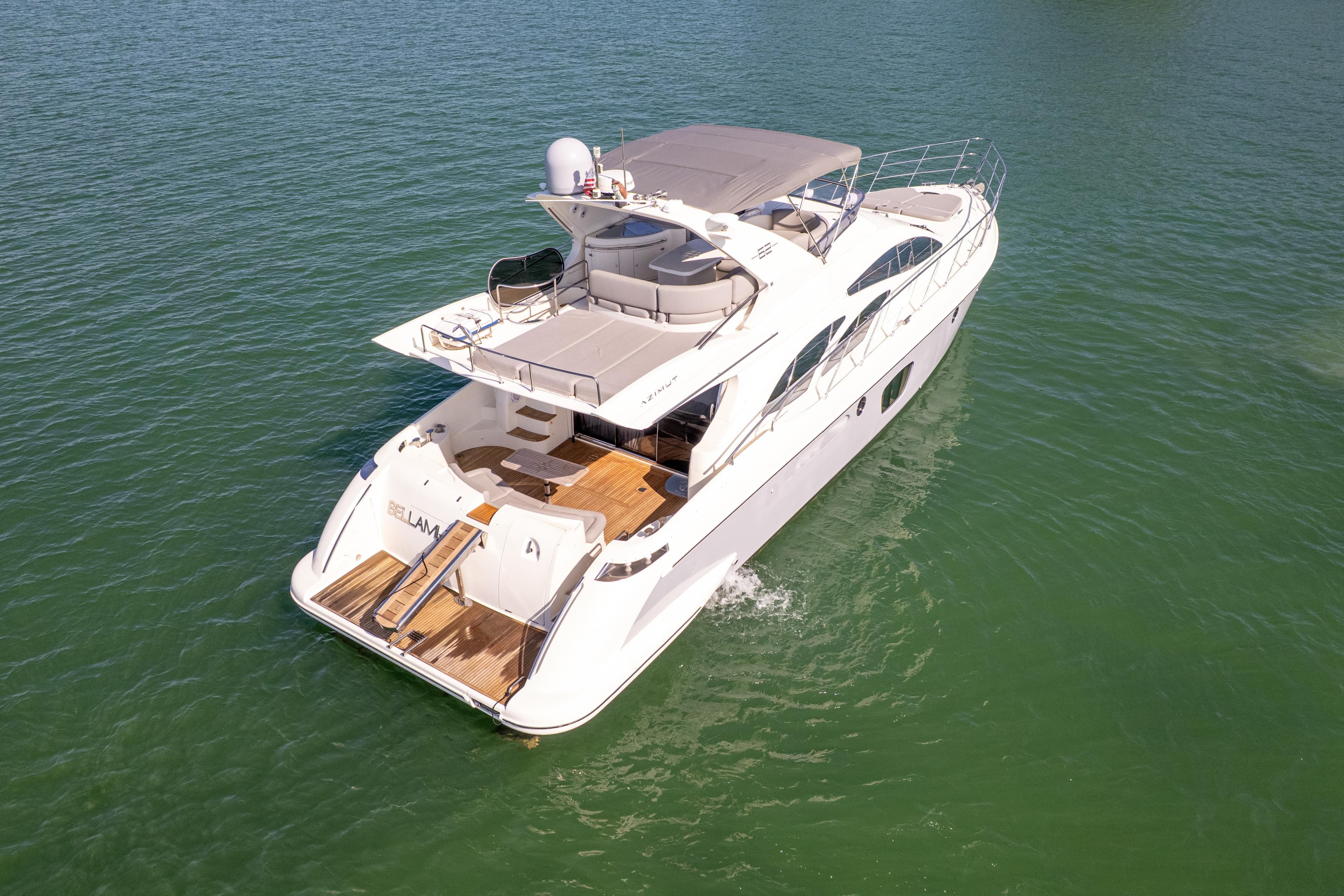 2008 Azimut 62E yacht cruising on calm green waters.