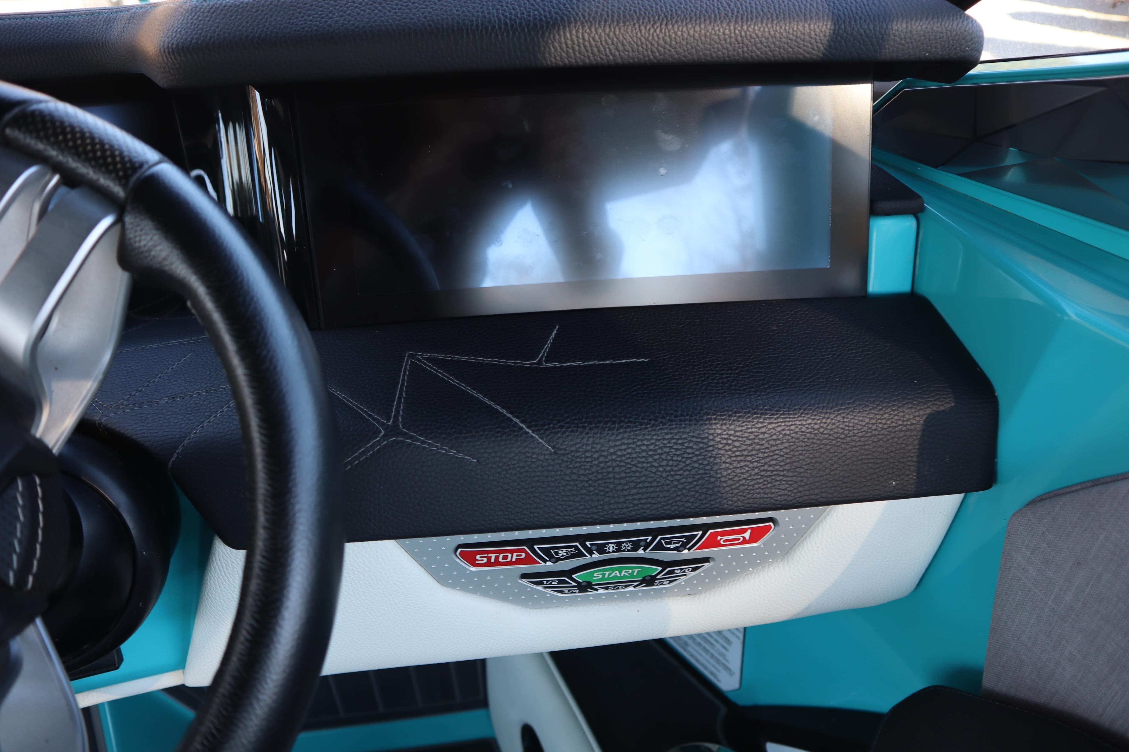2021 Nautique Super Air Nautique G23 Paragon dashboard with touchscreen and control buttons.
