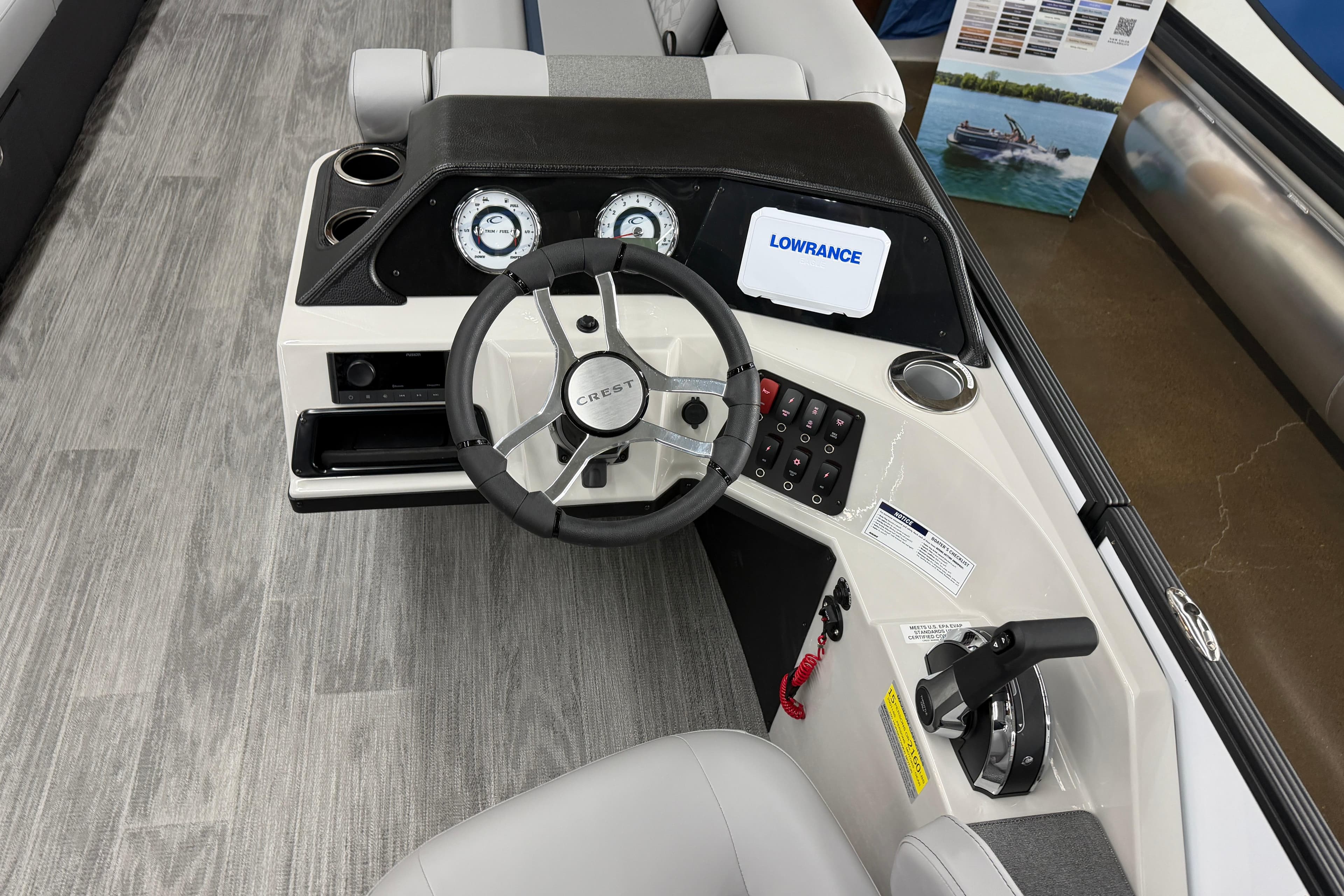 2026 Crest Conquest 250 SLSC boat dashboard with steering wheel and control panel.
