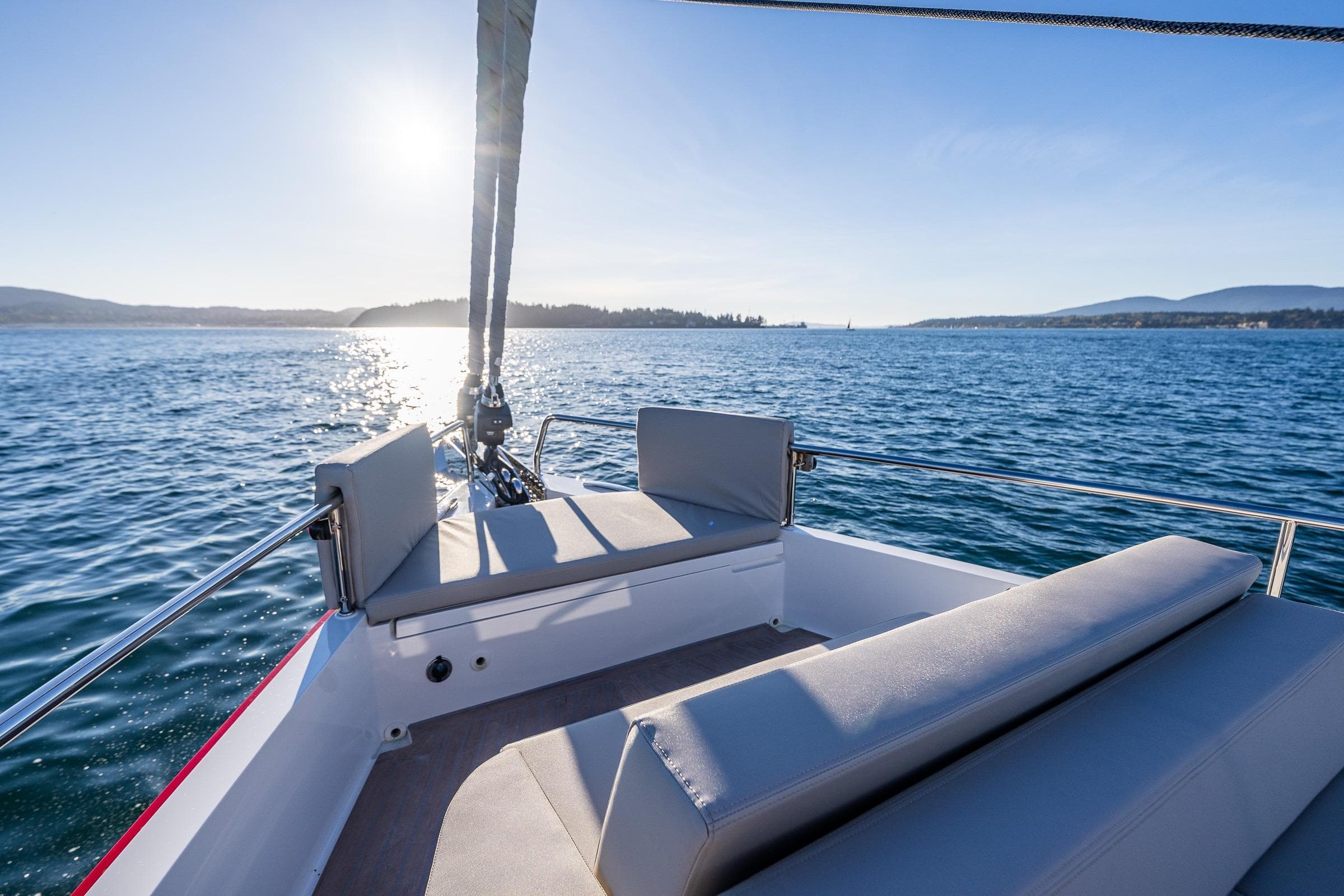 2024 Moody 41ds sailboat deck with ocean view and sunlight.