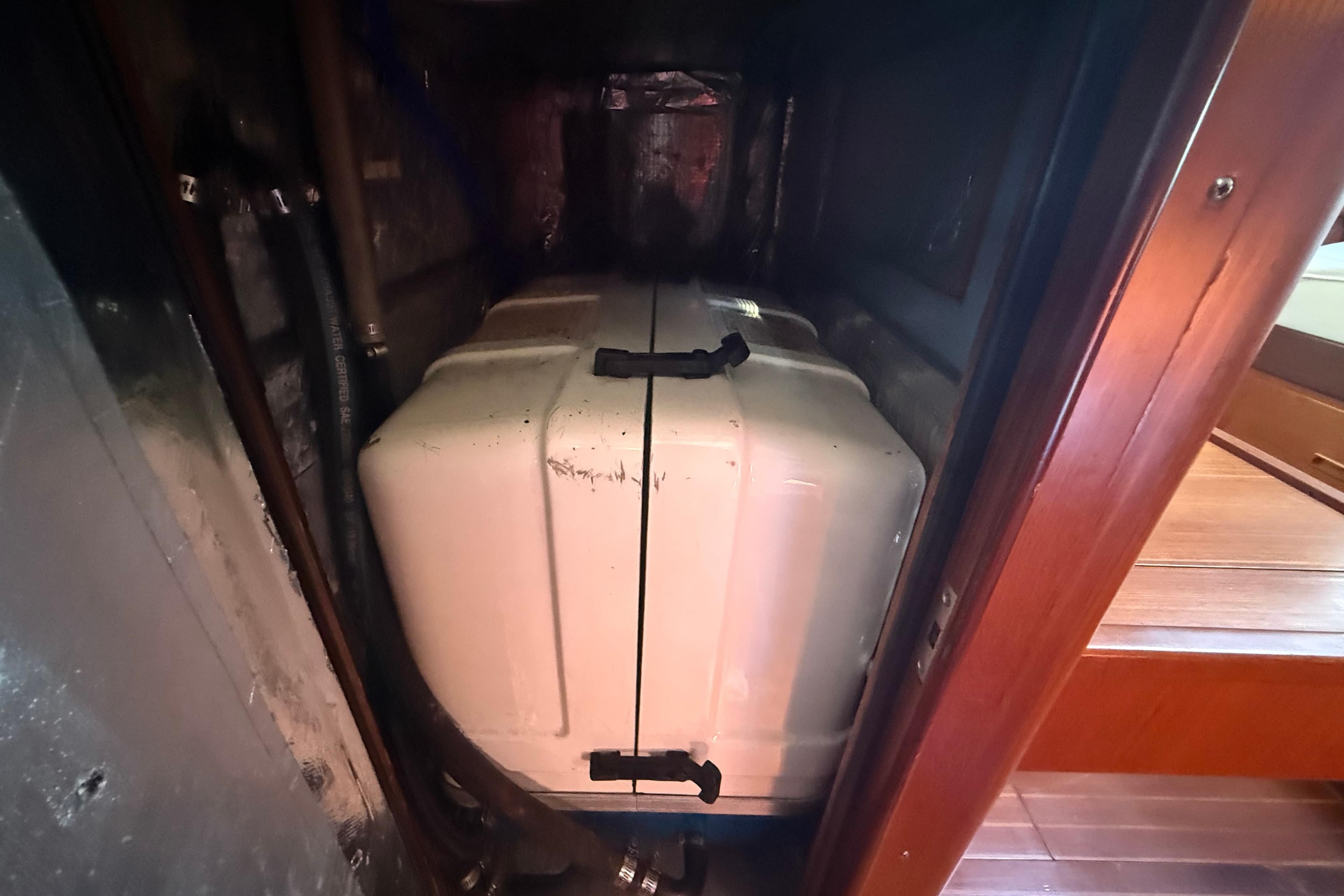 Engine compartment of a 1999 Passport 456 yacht, featuring a white engine cover.