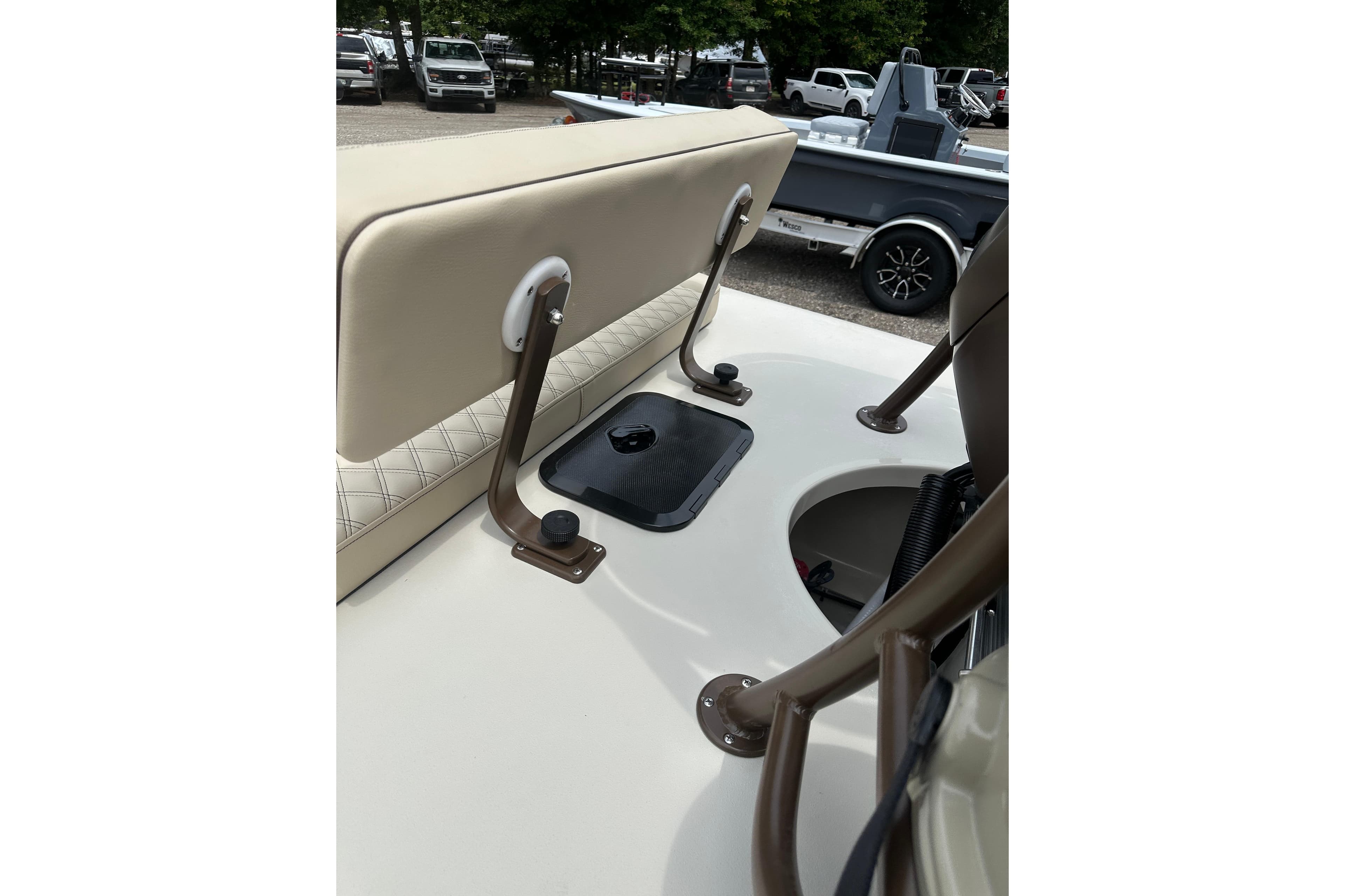 2027 Delta Boatworks Delta D18 interior with beige seating and storage compartments.