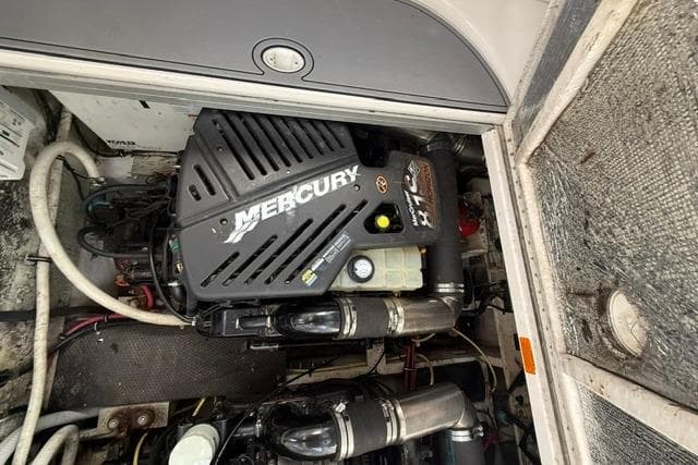 Engine compartment of a 2002 Chaparral 350 Signature with a Mercury engine.