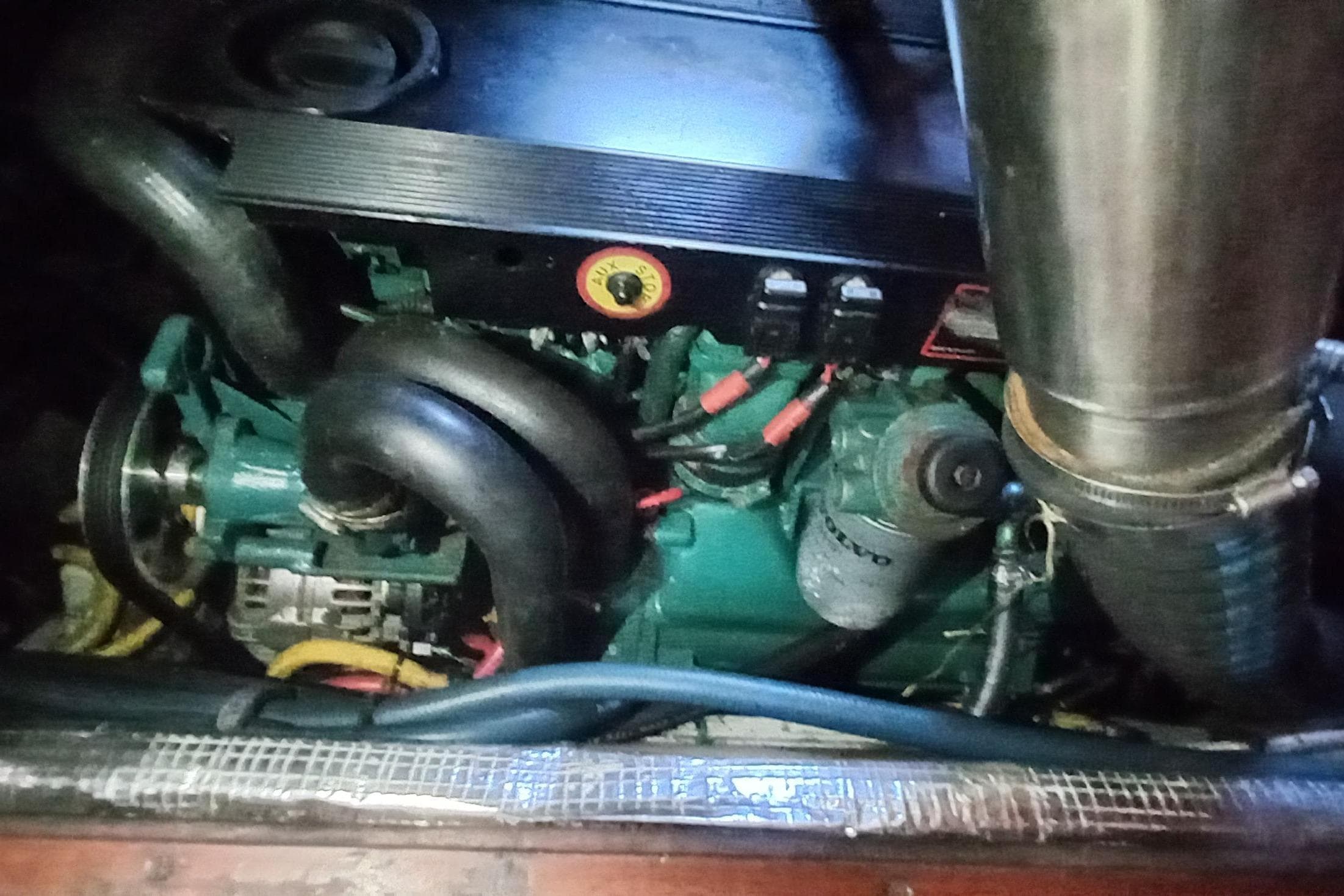 Engine compartment of a 1974 Hinckley 49 boat, featuring a Volvo Penta engine.