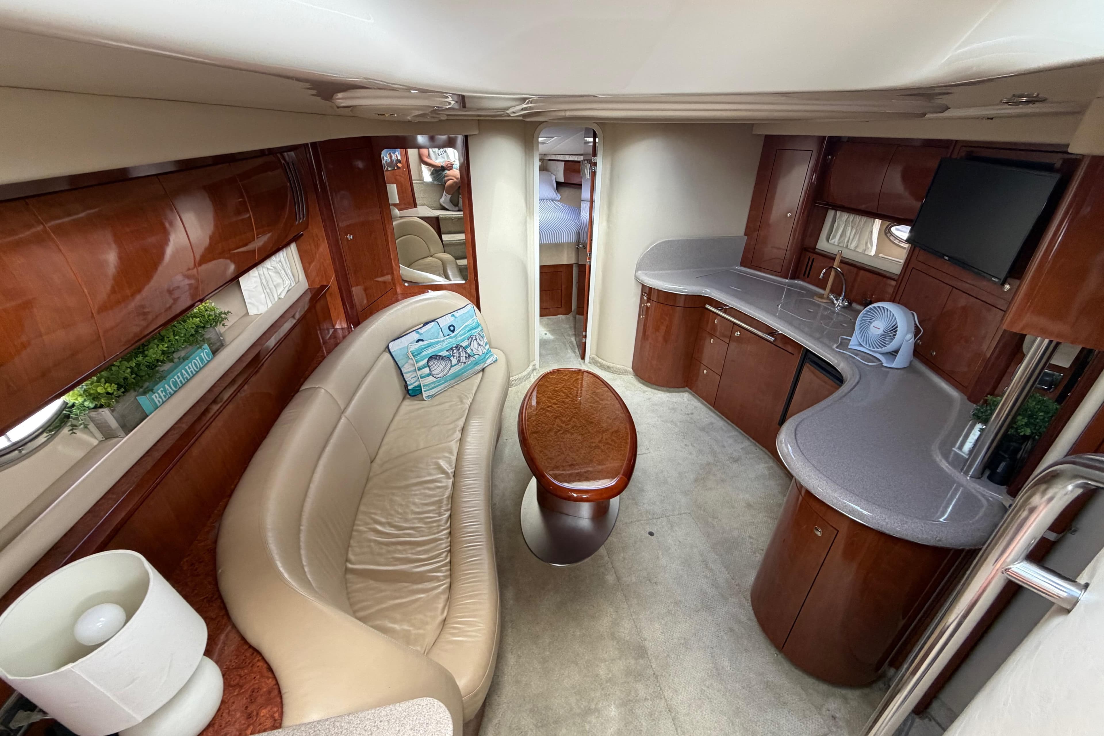 Luxurious interior of 2003 Sea Ray 420 Sundancer yacht with elegant seating and modern amenities.