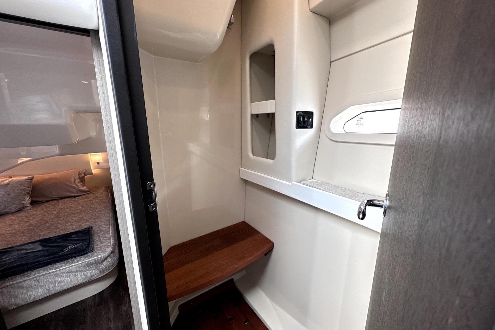 2021 Regal 38 XO interior cabin with cozy bed and modern design elements.