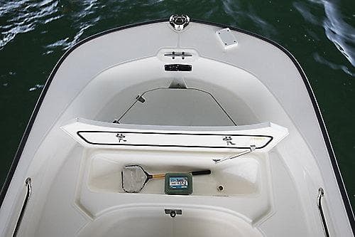 2027 Boston Whaler 170 Montauk boat interior with open storage compartment.