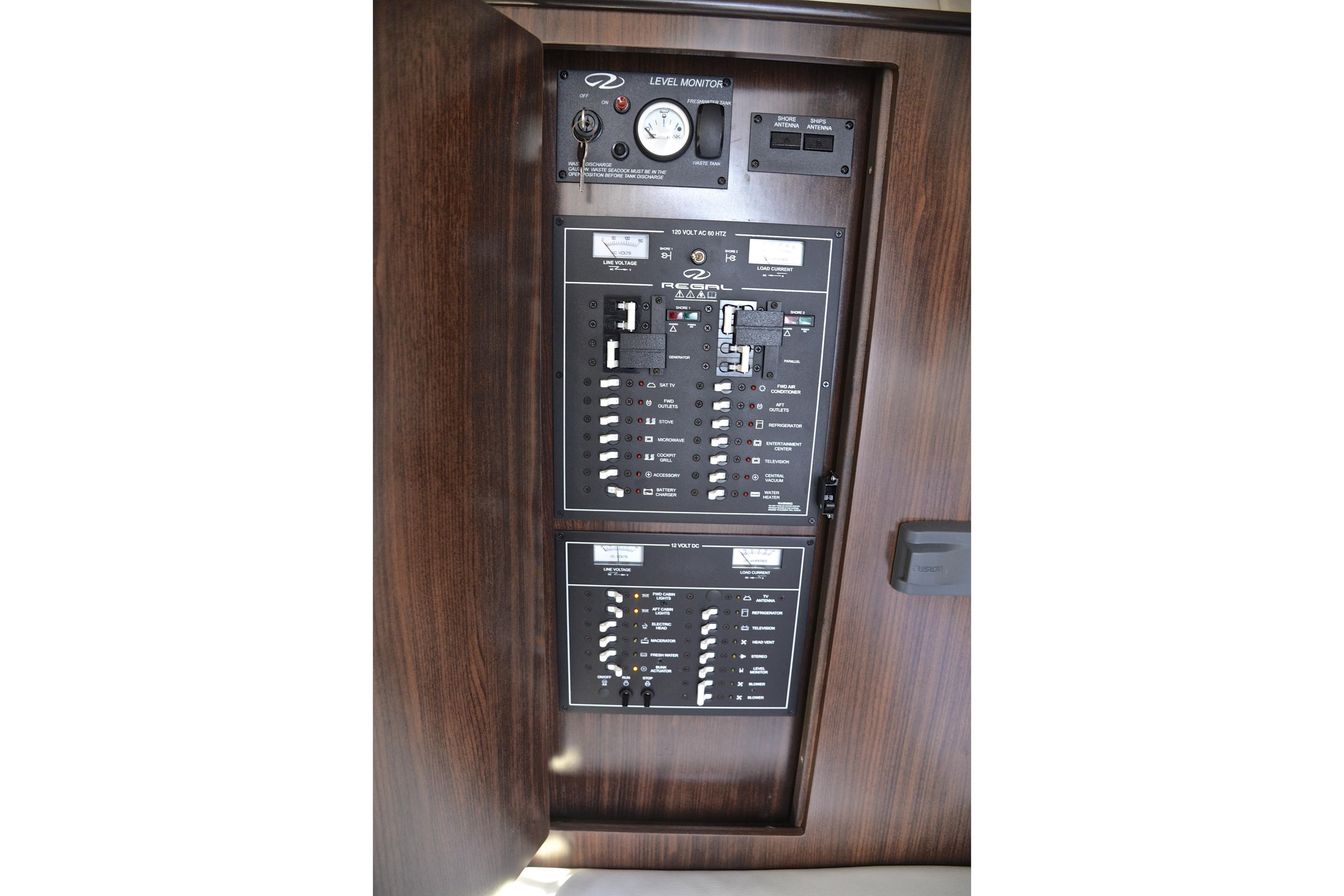 Electrical control panel on 2018 Regal 33 Express boat, featuring switches and gauges.