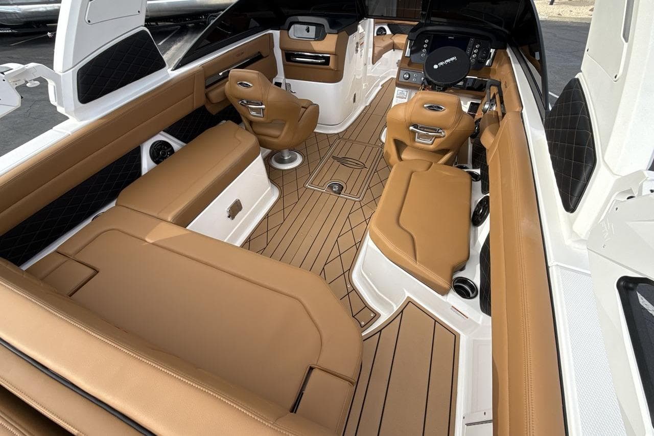 2026 Chaparral GTS 6 boat interior with tan leather seating and modern dashboard.