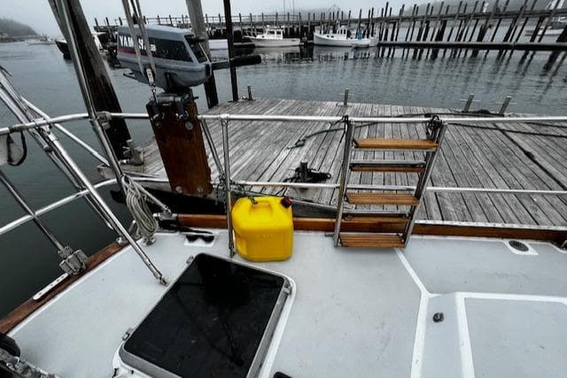 Deck view of a 1990 Bristol 47.7 Cutter/Sloop docked at a marina.