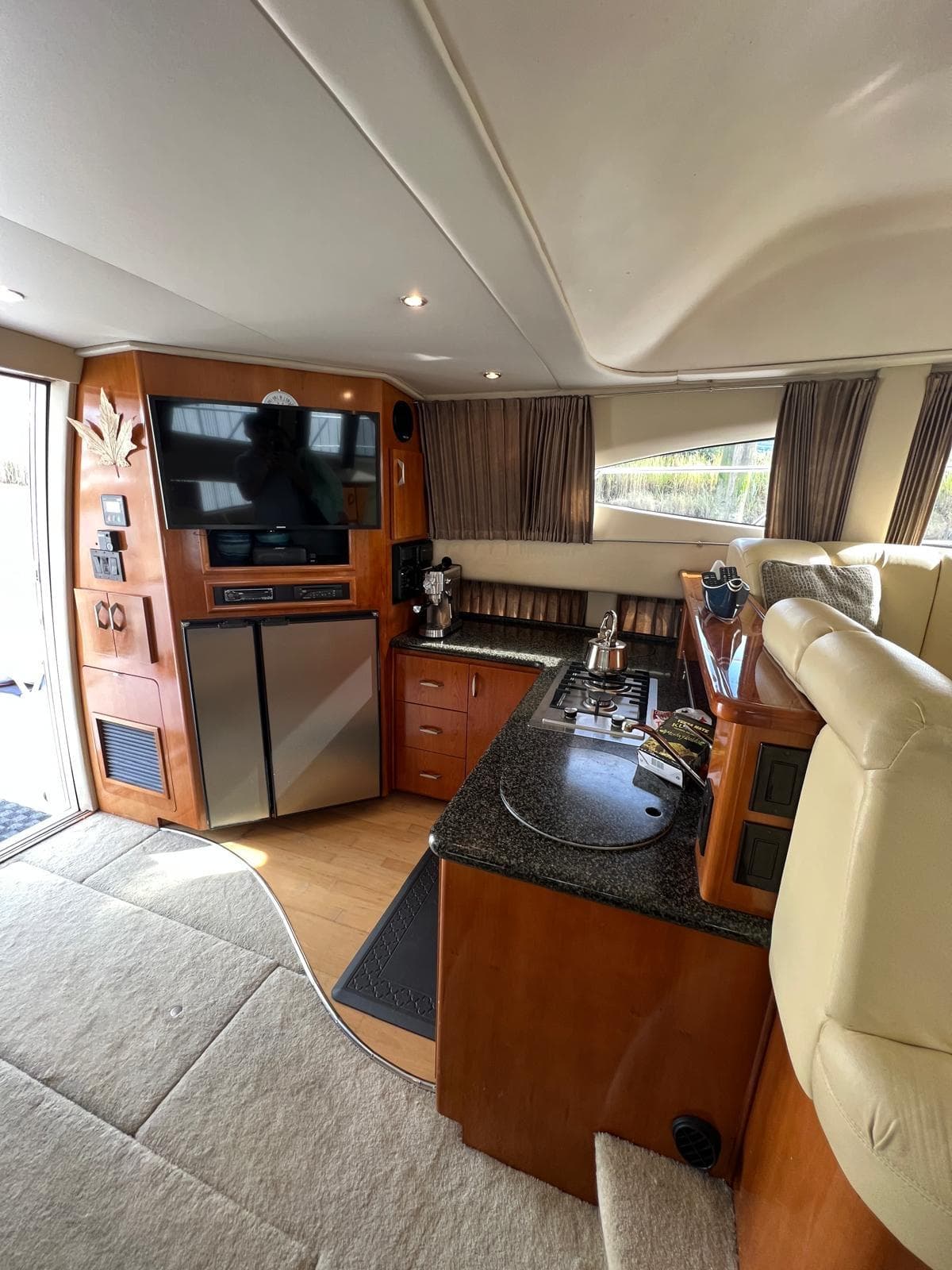 Interior of 2003 Carver 360 Sport Sedan with modern kitchen and entertainment area.