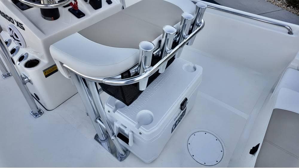 2025 Bulls Bay 2200 XS boat interior with rod holders and cooler storage.